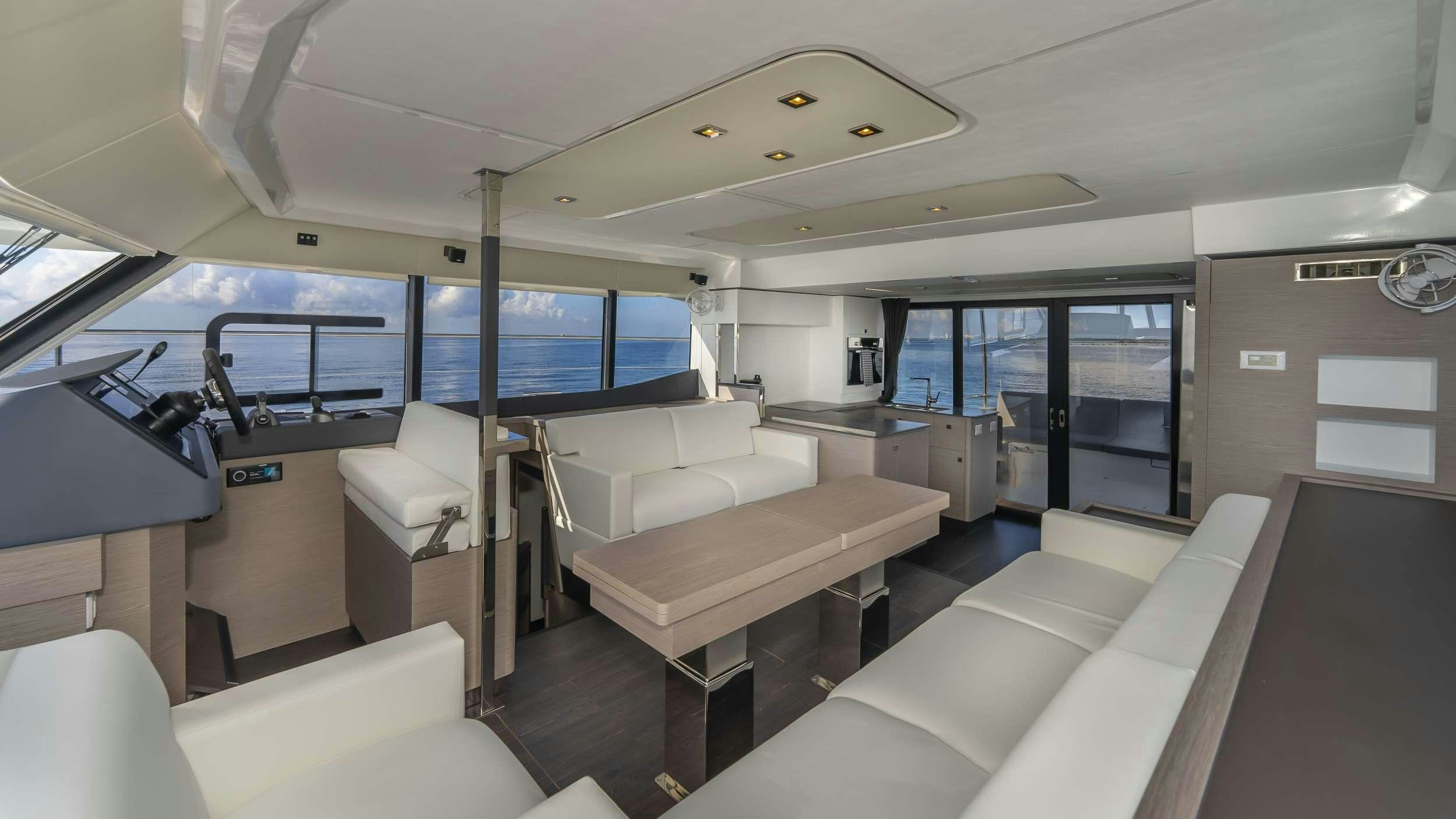 a room with a table and couches aboard PRINCESS Yacht for Charter