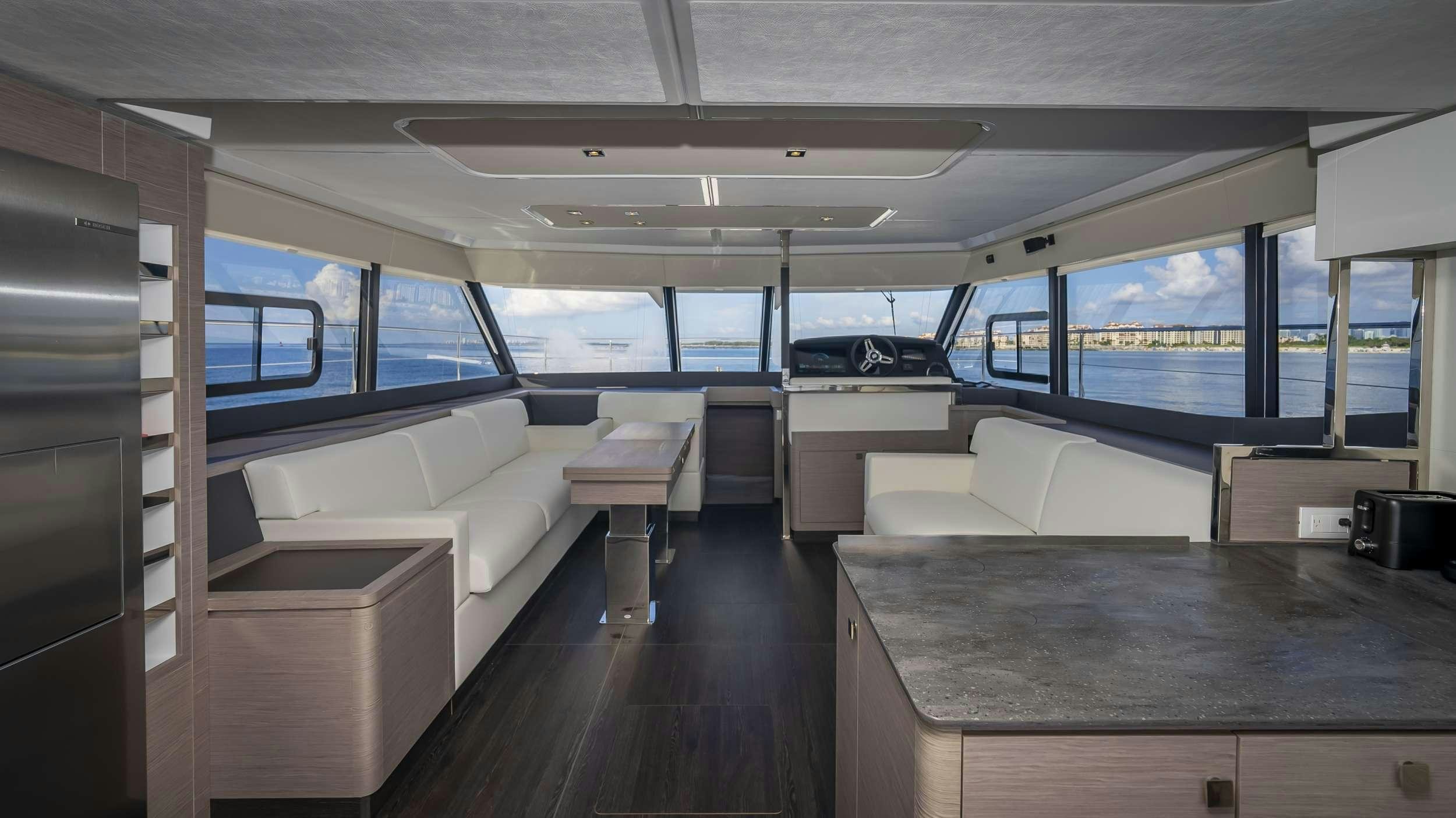 a room with a couch and a table aboard PRINCESS Yacht for Charter
