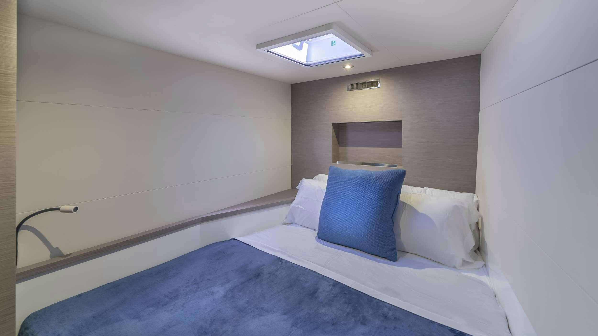 a bed with pillows aboard PRINCESS Yacht for Charter