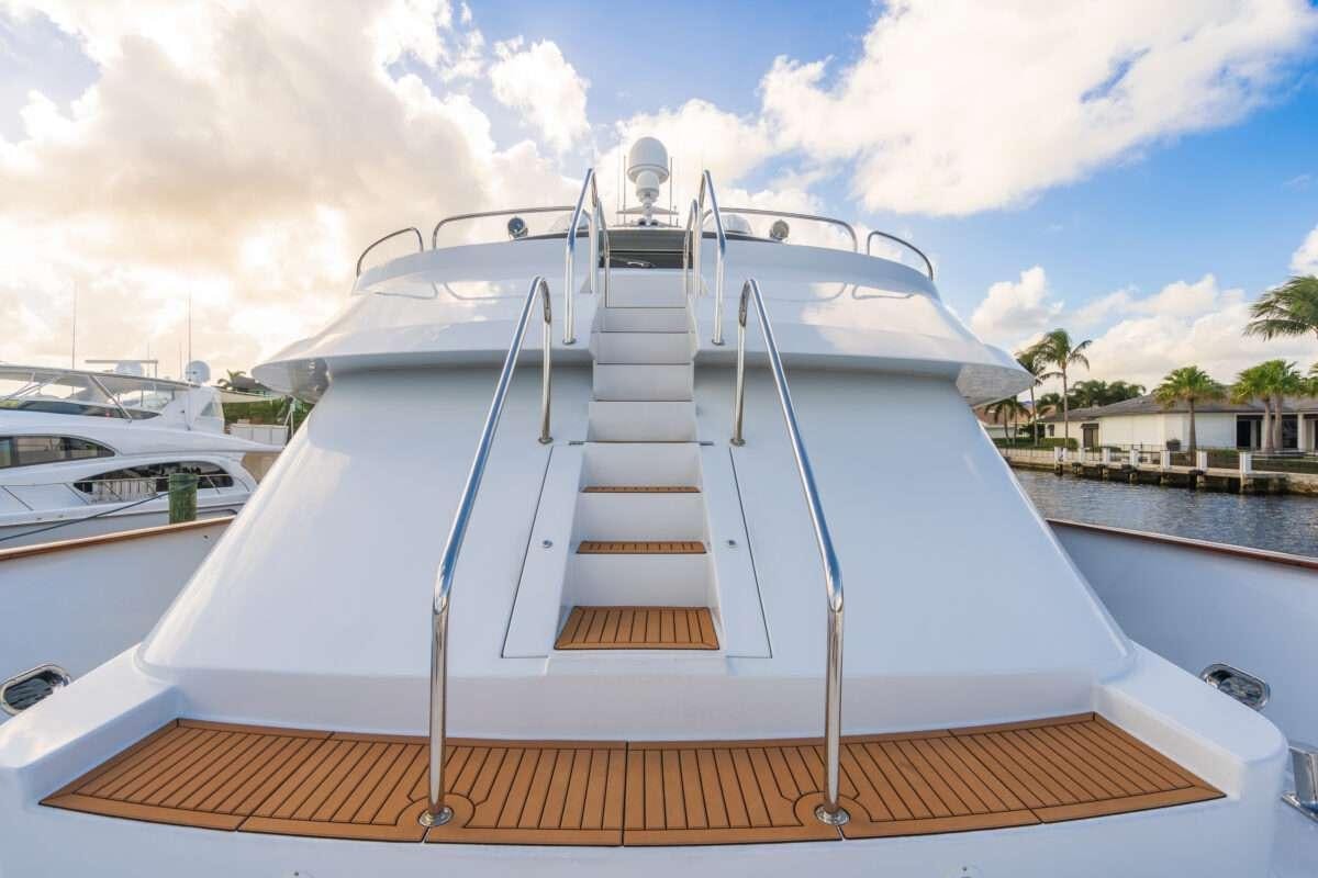 a boat with a staircase on the front aboard CHANSON Yacht for Charter