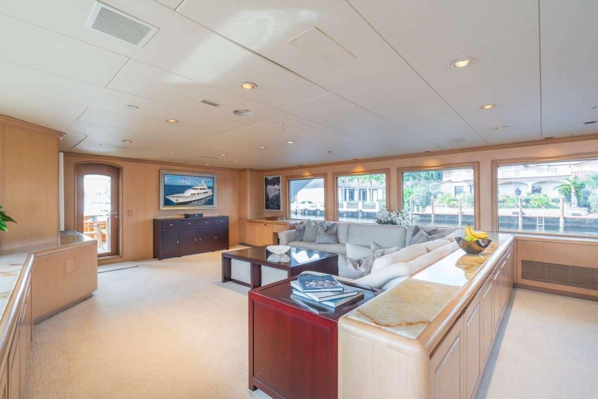 a large living room with a large window aboard CHANSON Yacht for Charter