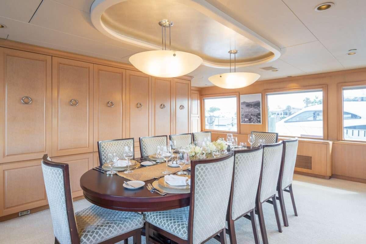 a dining room with a table and chairs aboard CHANSON Yacht for Charter