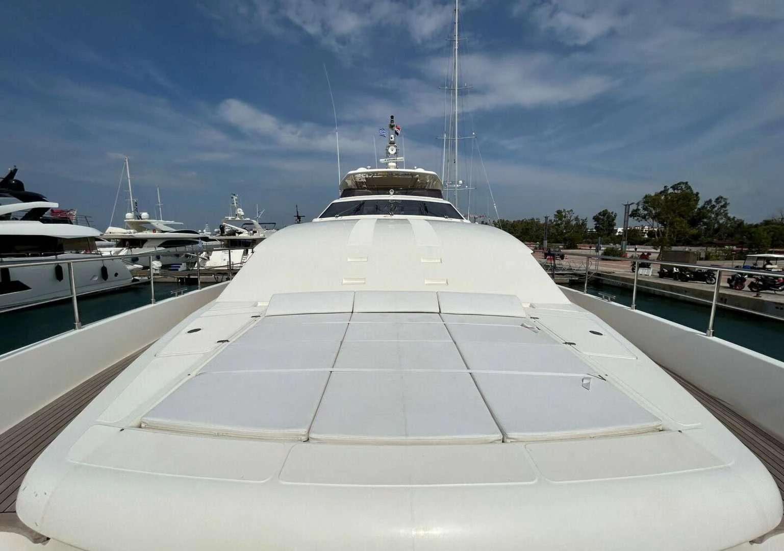a large white boat in a harbor aboard WATCH ME Yacht for Charter