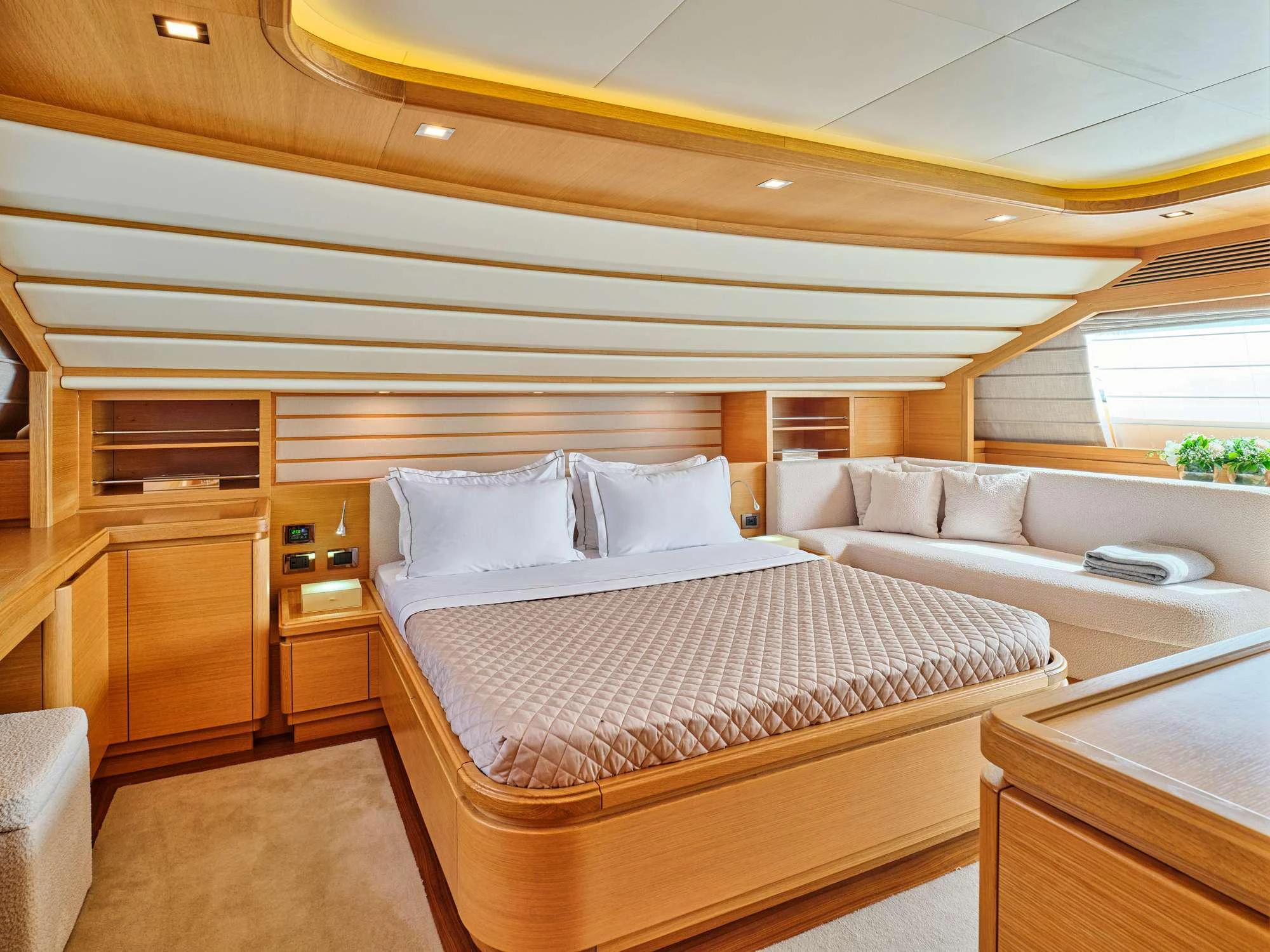 a room with a bed and a couch aboard WATCH ME Yacht for Charter