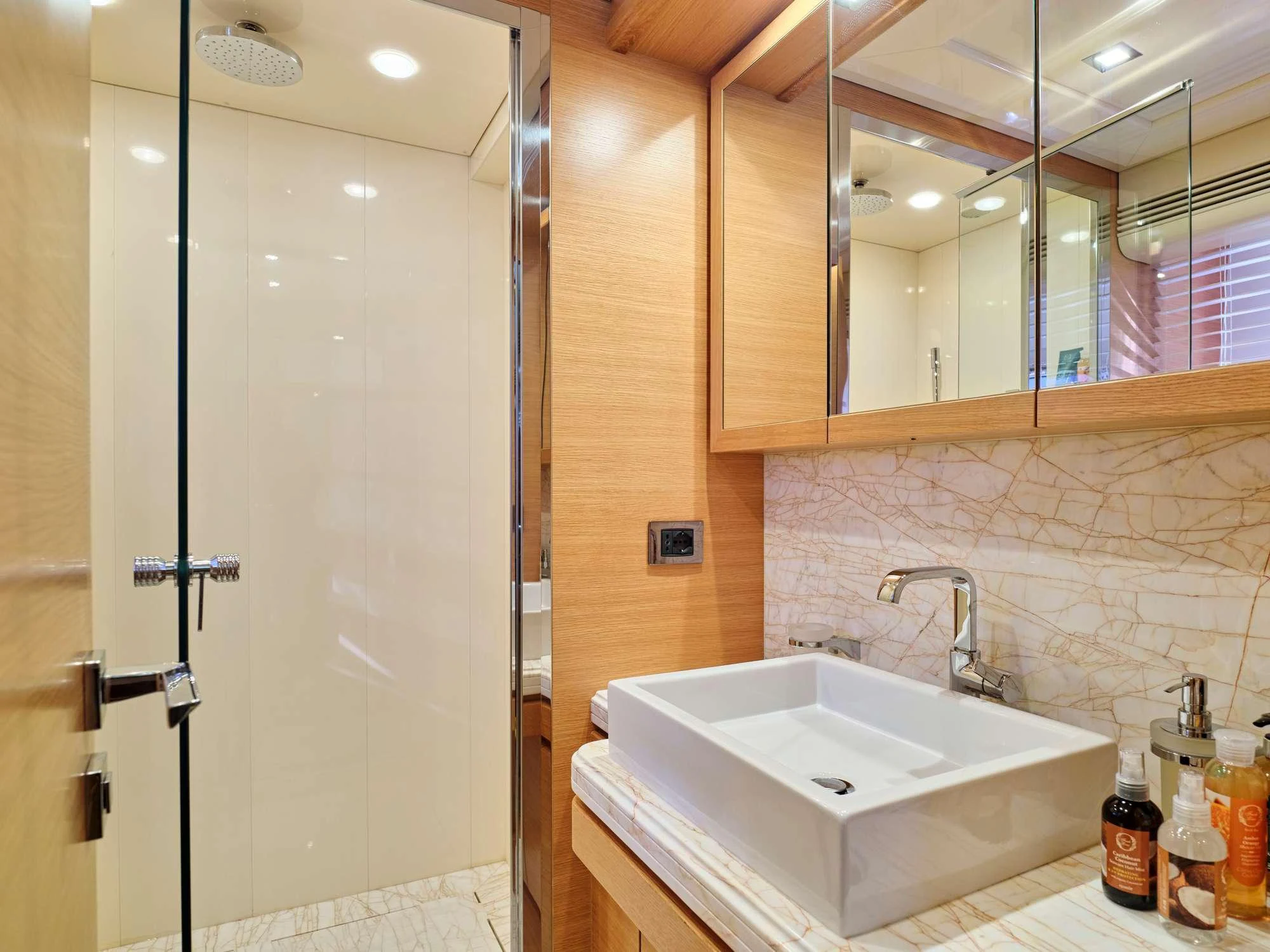 a bathroom with a sink and a shower aboard WATCH ME Yacht for Charter