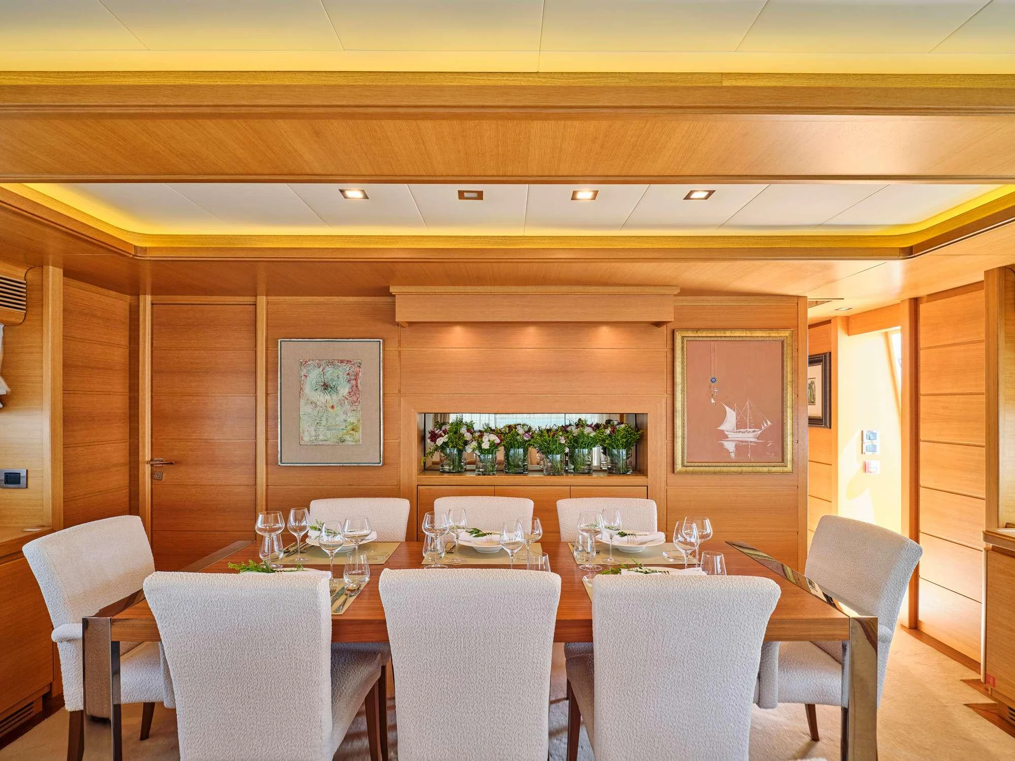 a room with tables and chairs aboard WATCH ME Yacht for Charter