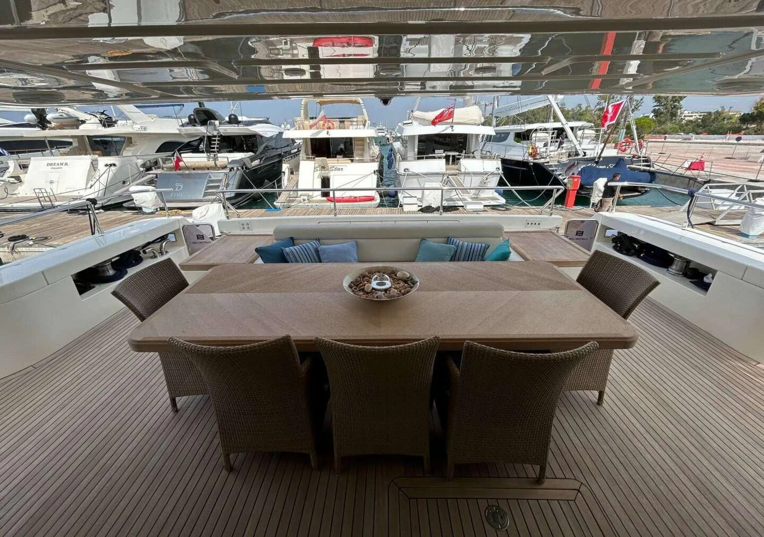 a table with chairs around it aboard WATCH ME Yacht for Charter