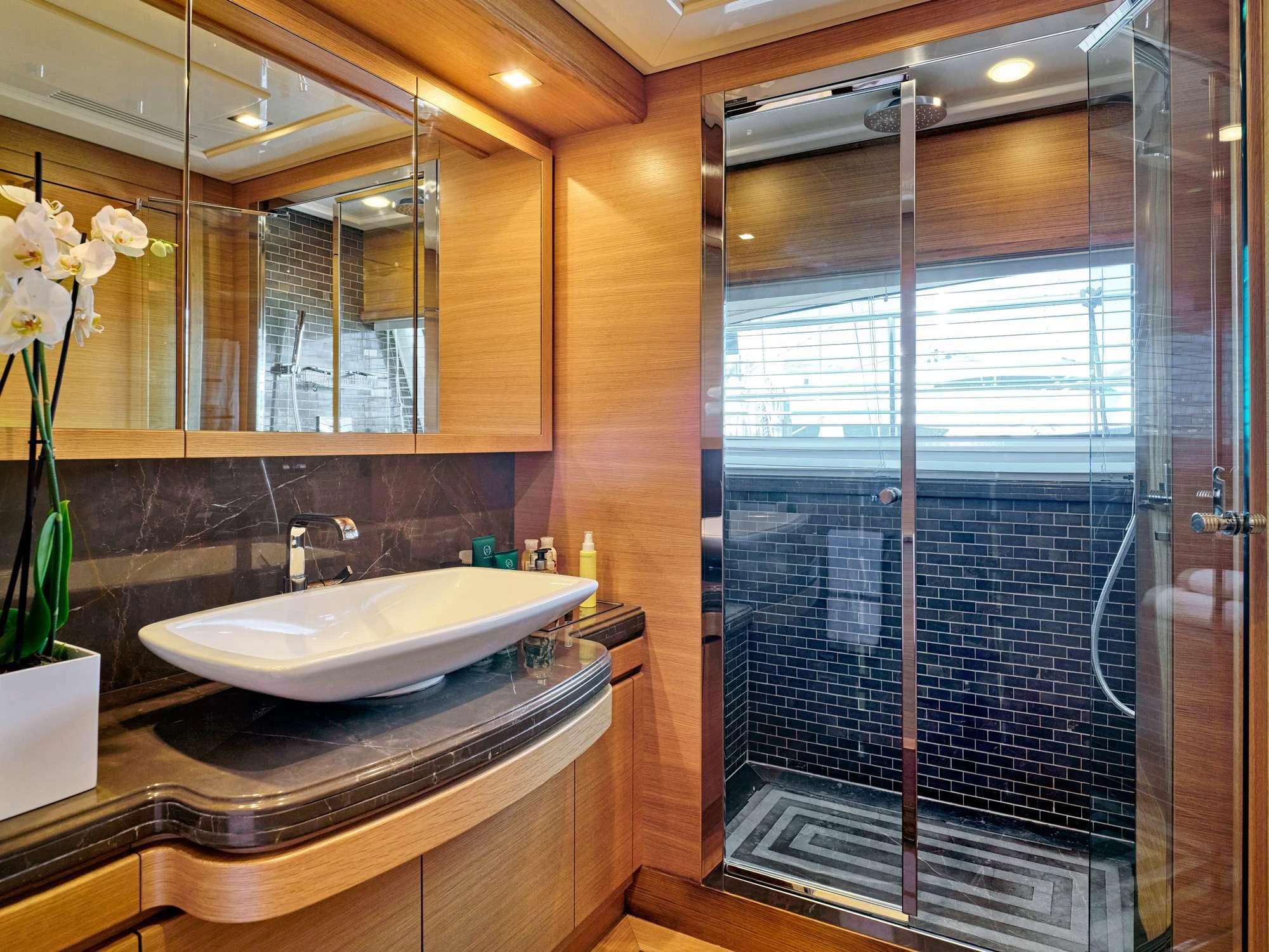 a bathroom with a glass shower aboard WATCH ME Yacht for Charter