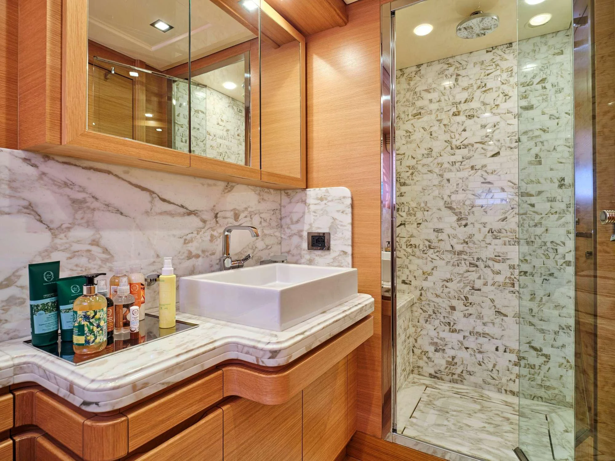 a bathroom with a glass shower aboard WATCH ME Yacht for Charter