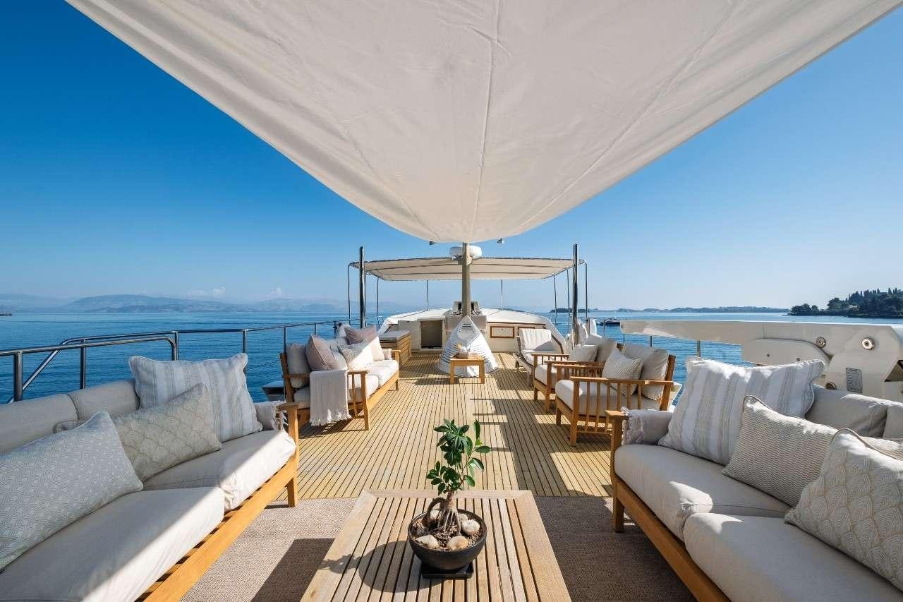 a large tent with a lounge area aboard STALCA Yacht for Charter