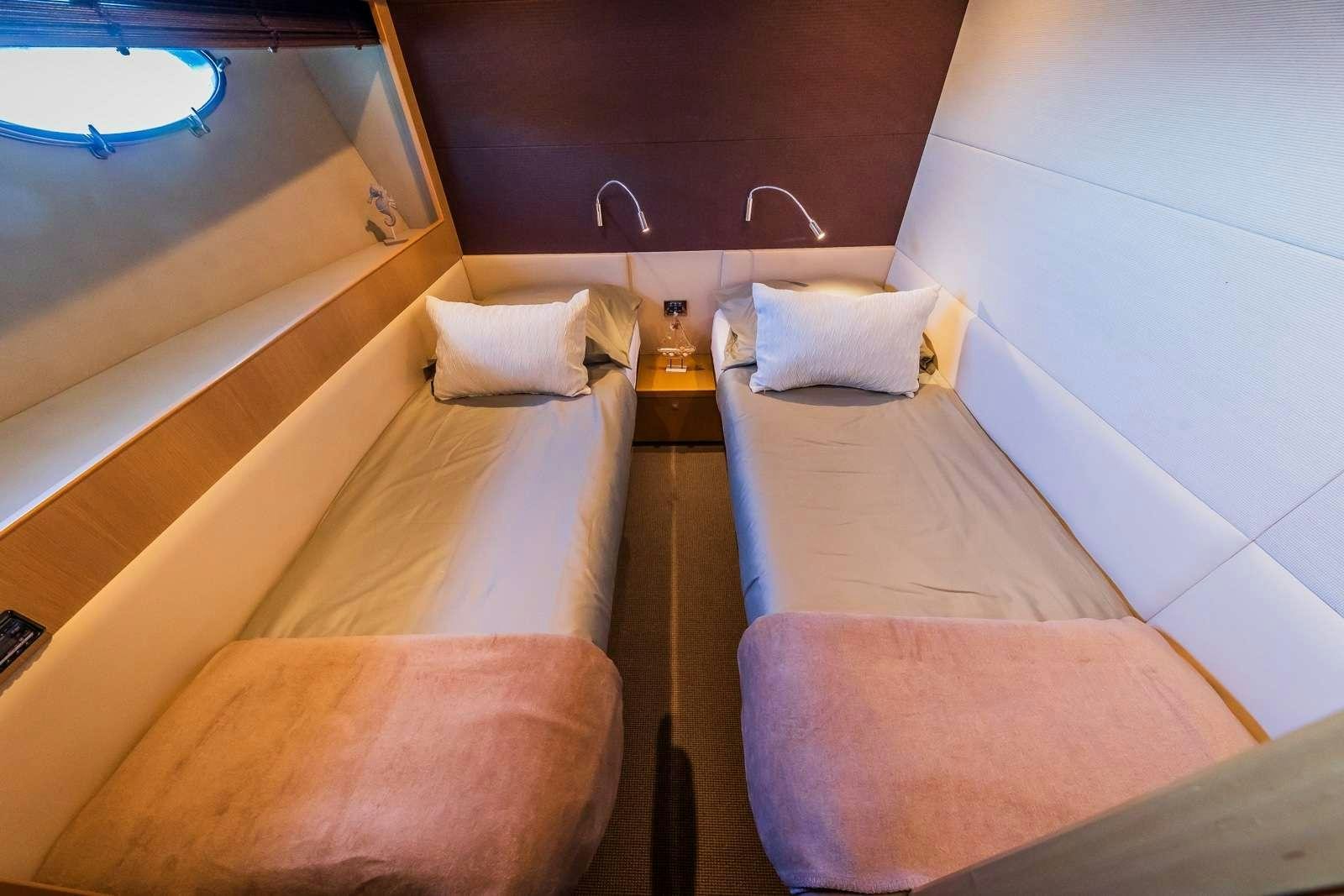 a couple of beds in a room aboard GITANA II Yacht for Charter