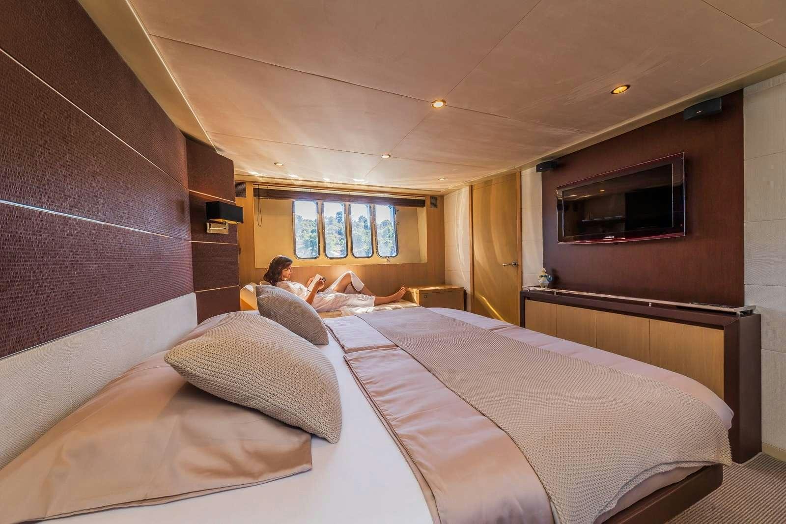a room with two beds aboard GITANA II Yacht for Charter