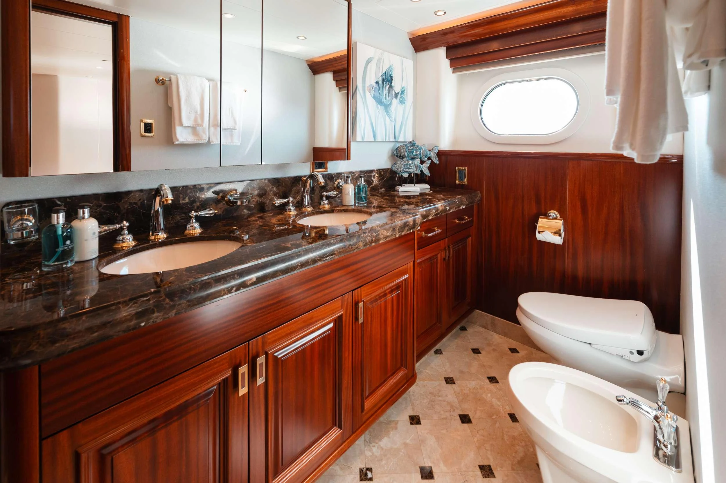 a bathroom with a sink and a toilet aboard BLUE TIME Yacht for Charter