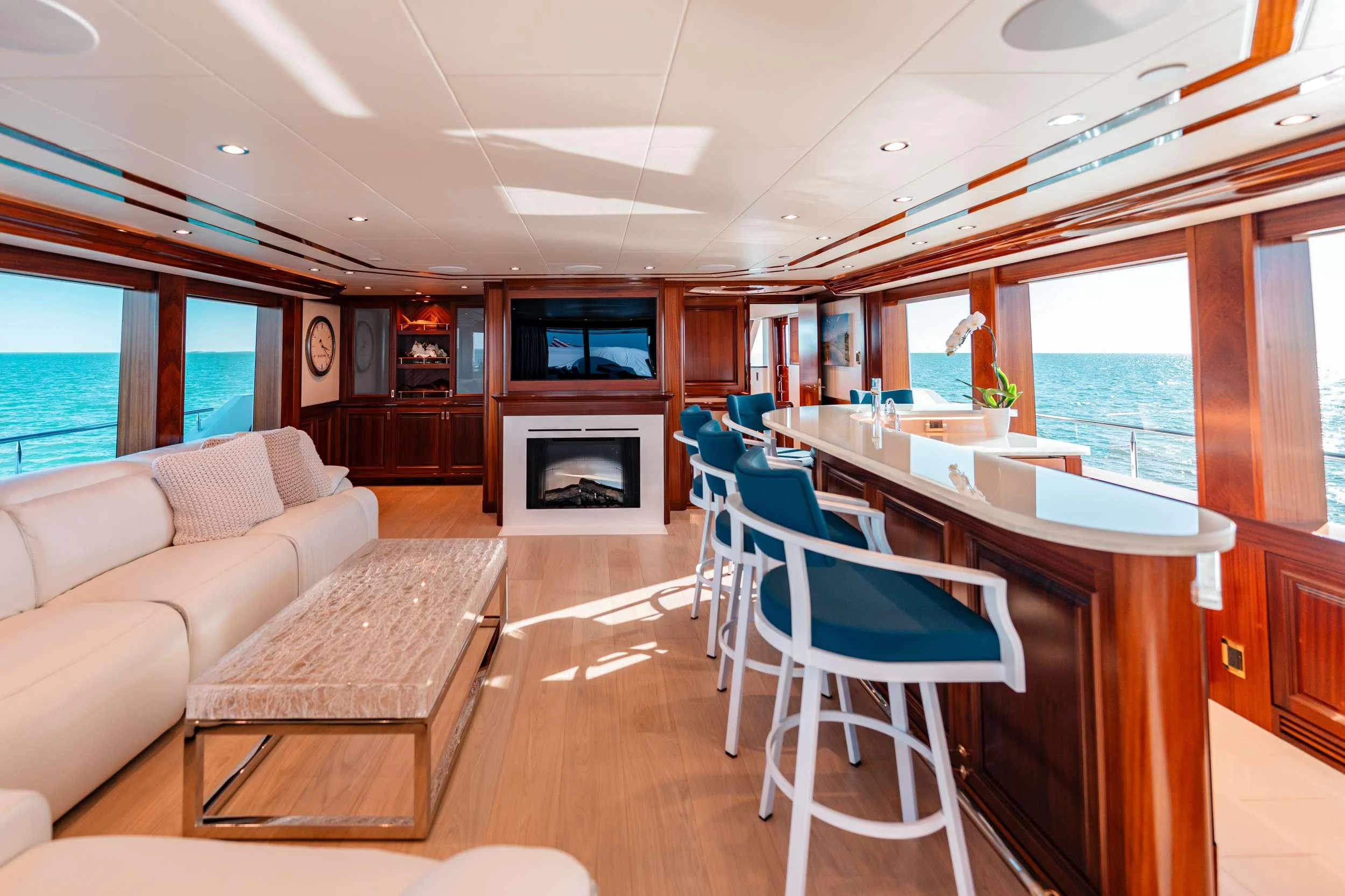 a living room with a table and chairs aboard BLUE TIME Yacht for Charter