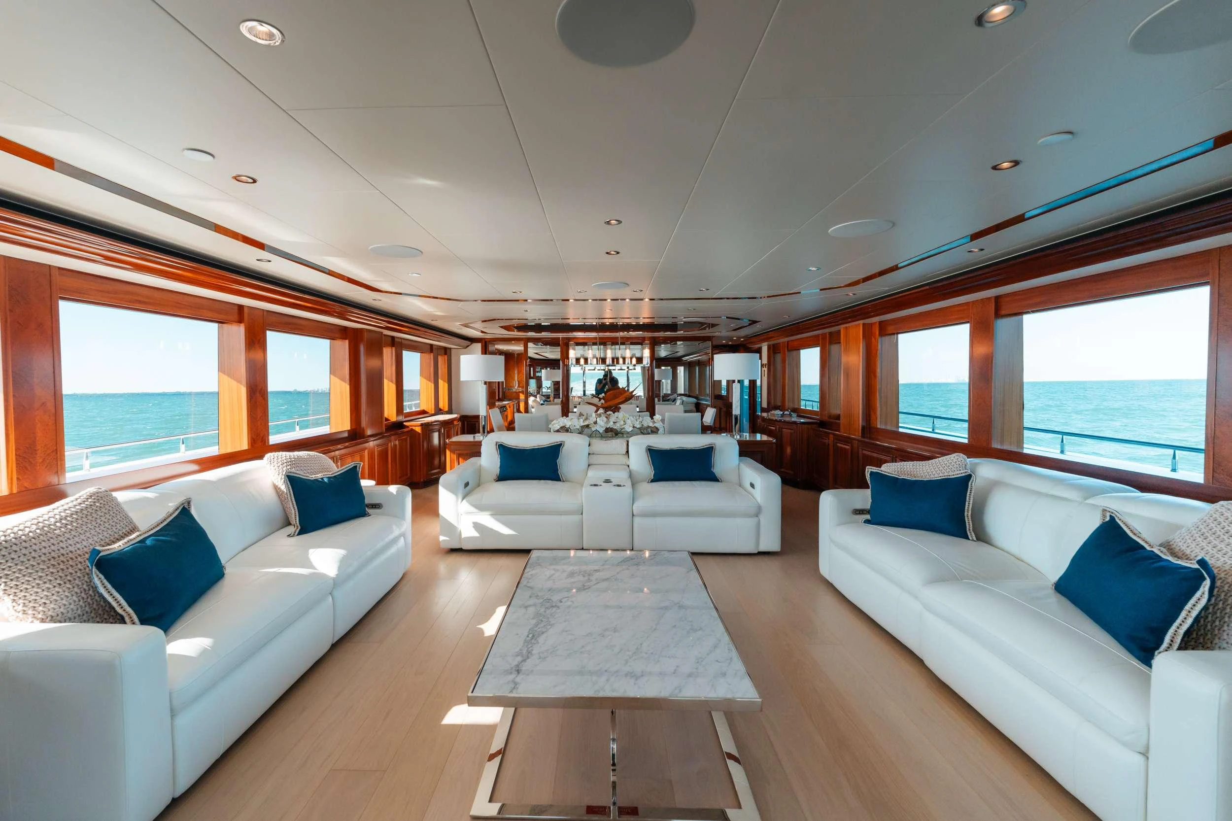 a large living room with a large open window aboard BLUE TIME Yacht for Charter