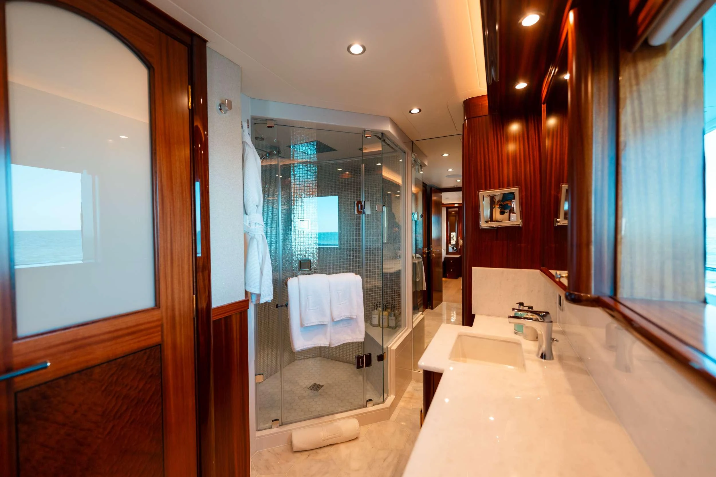 a bathroom with a glass shower aboard BLUE TIME Yacht for Charter