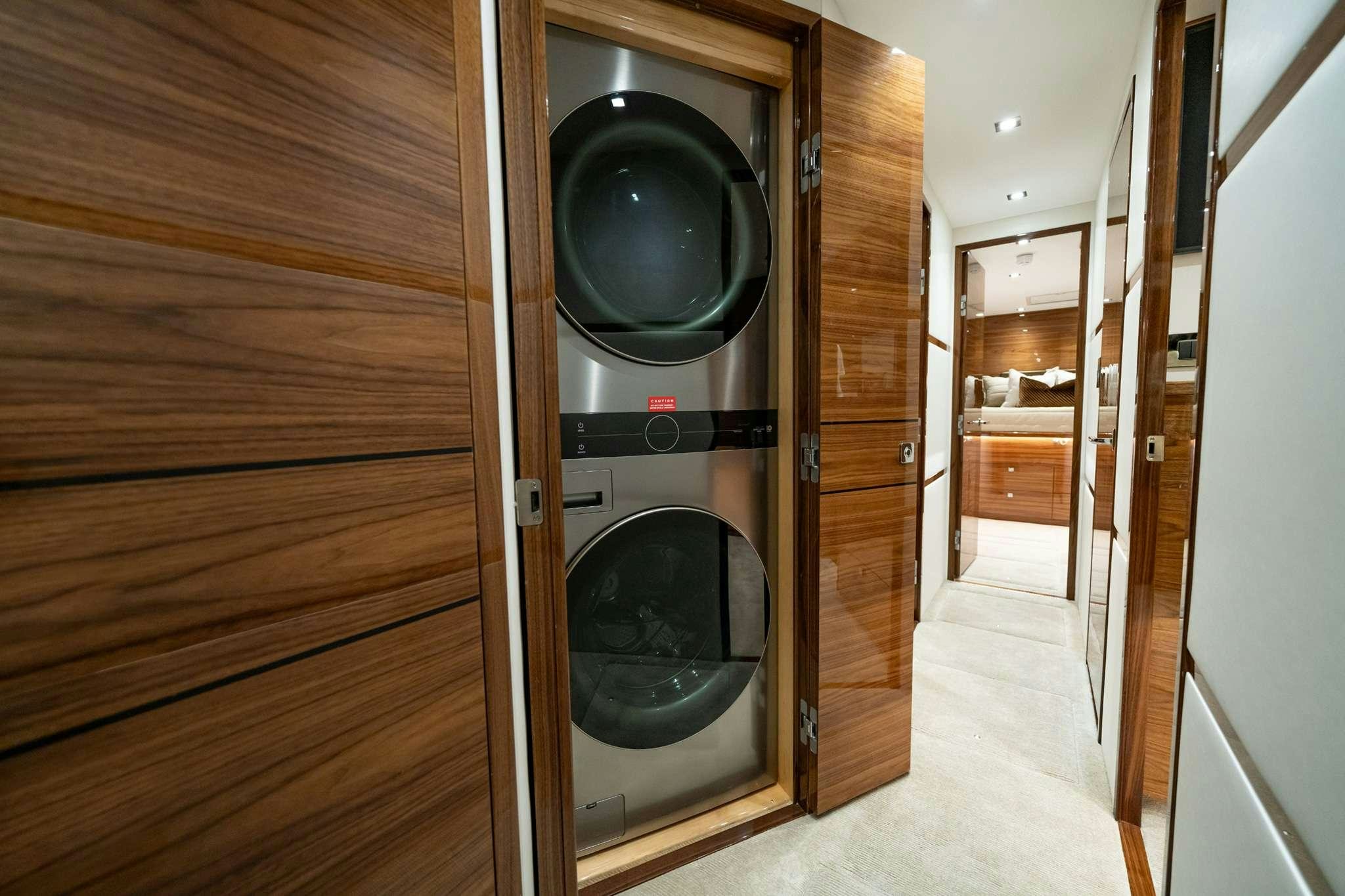a room with a large mirror aboard BOUJIE Yacht for Charter