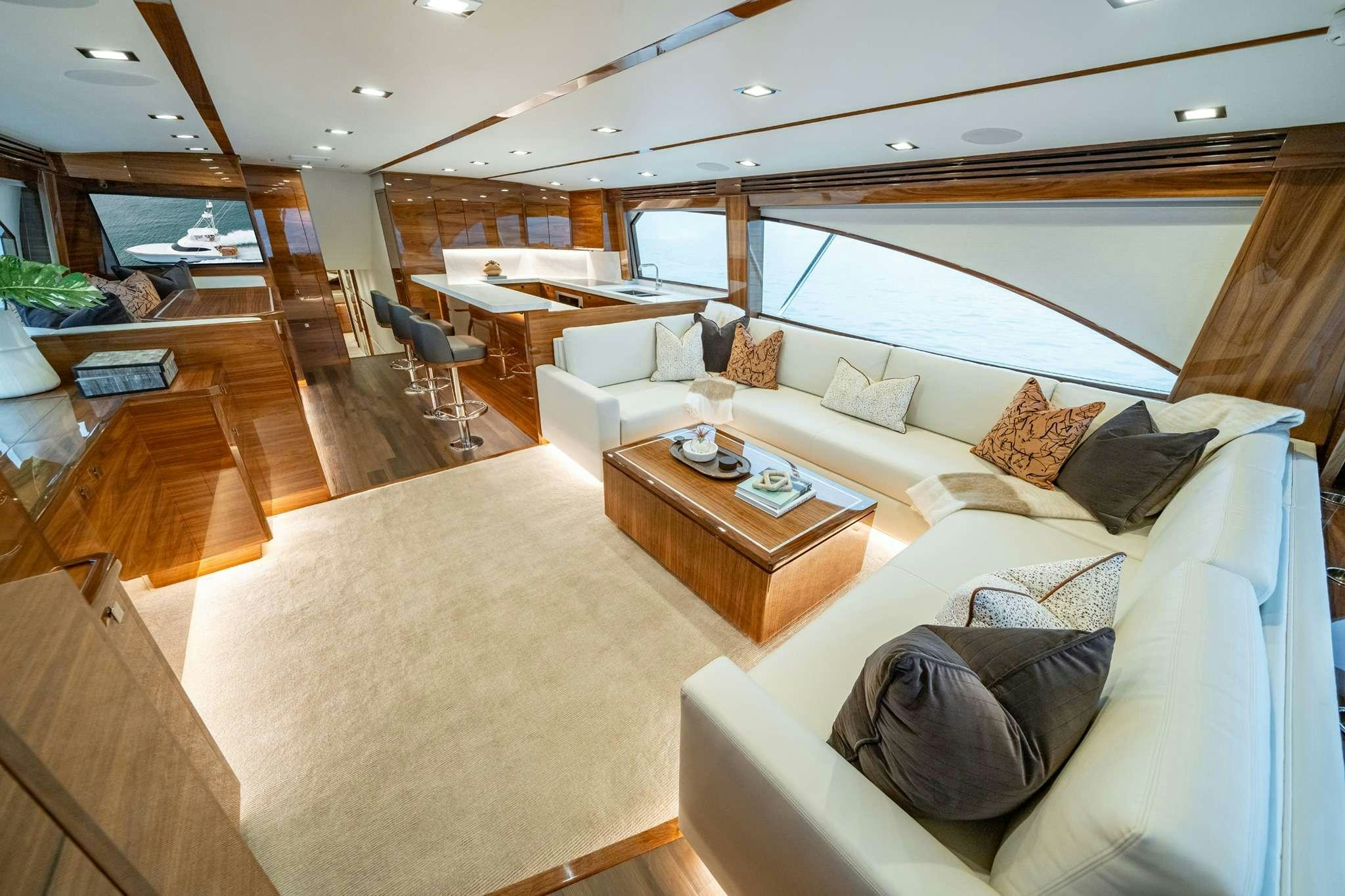 a living room with a large window aboard BOUJIE Yacht for Charter