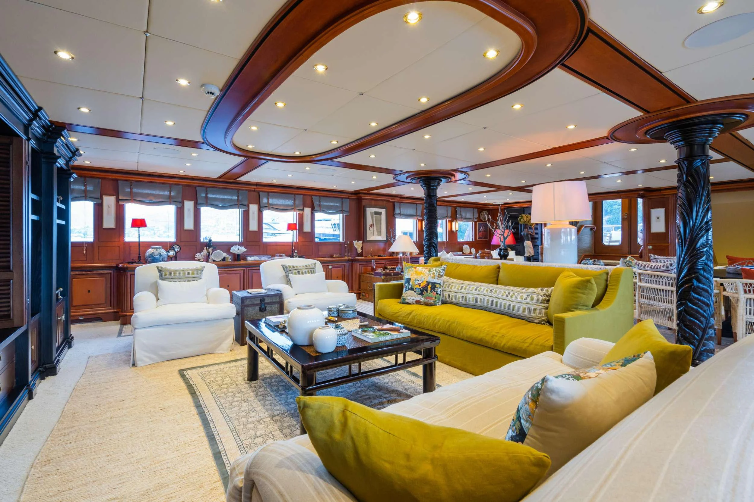 a room with couches and a table aboard YAZZ Yacht for Charter