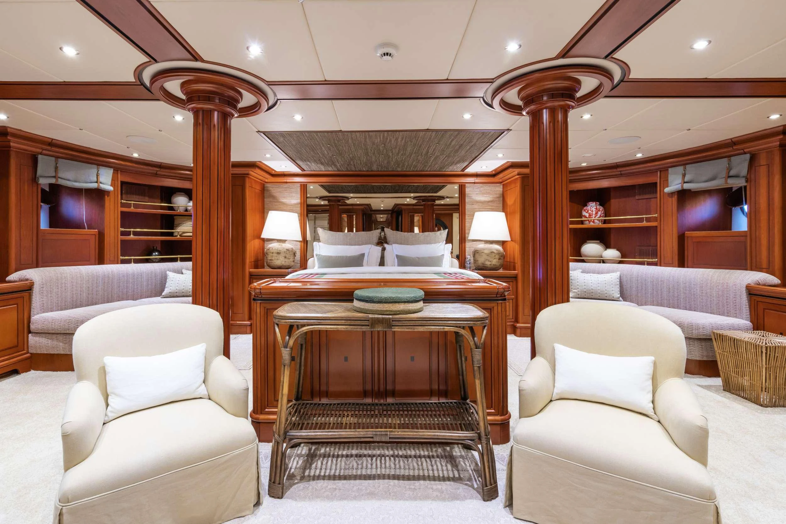 a room with a bed and a chair aboard YAZZ Yacht for Charter