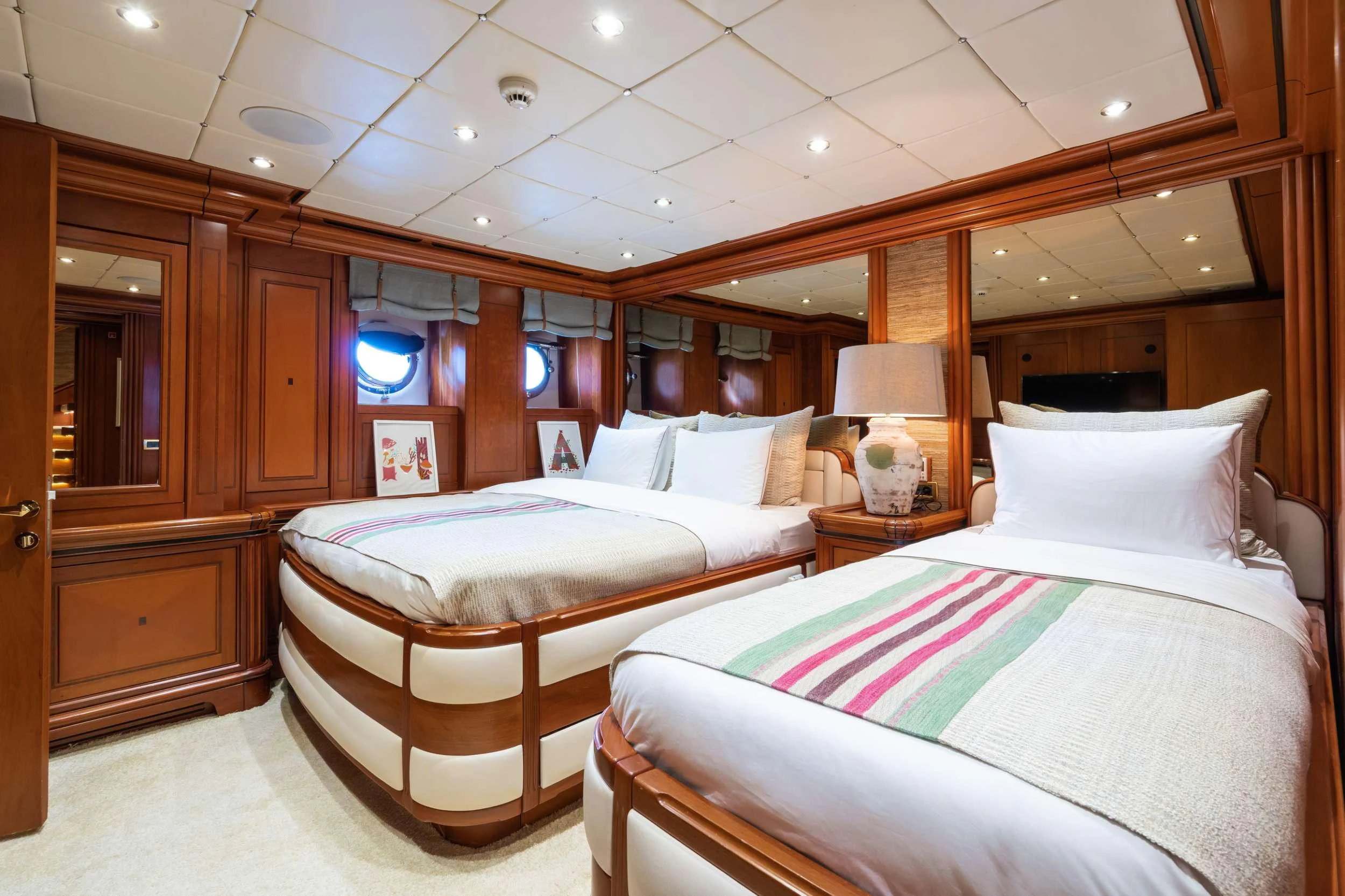 a couple of beds in a room aboard YAZZ Yacht for Charter