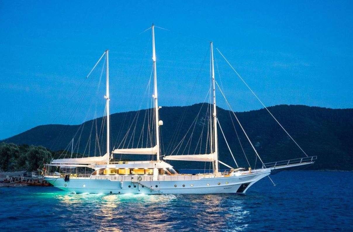 a large white boat on the water aboard BELLA MARE Yacht for Charter