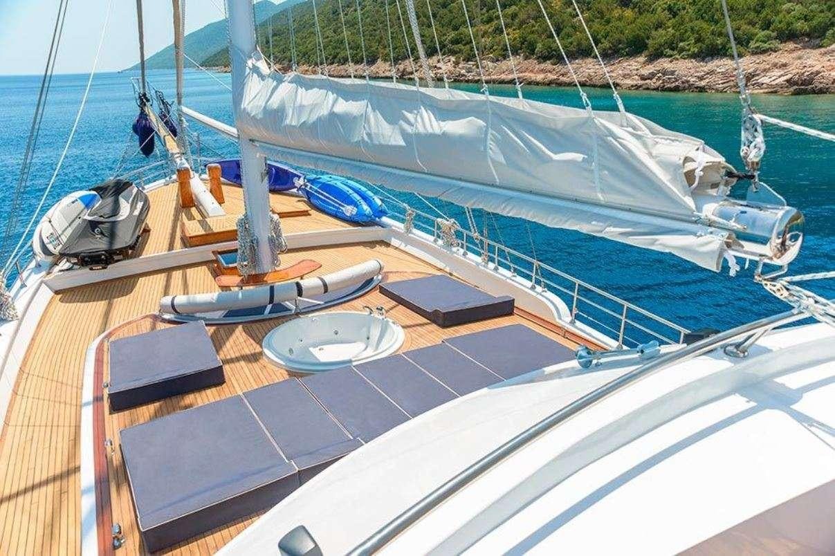 a boat with a deck and a deck aboard BELLA MARE Yacht for Charter