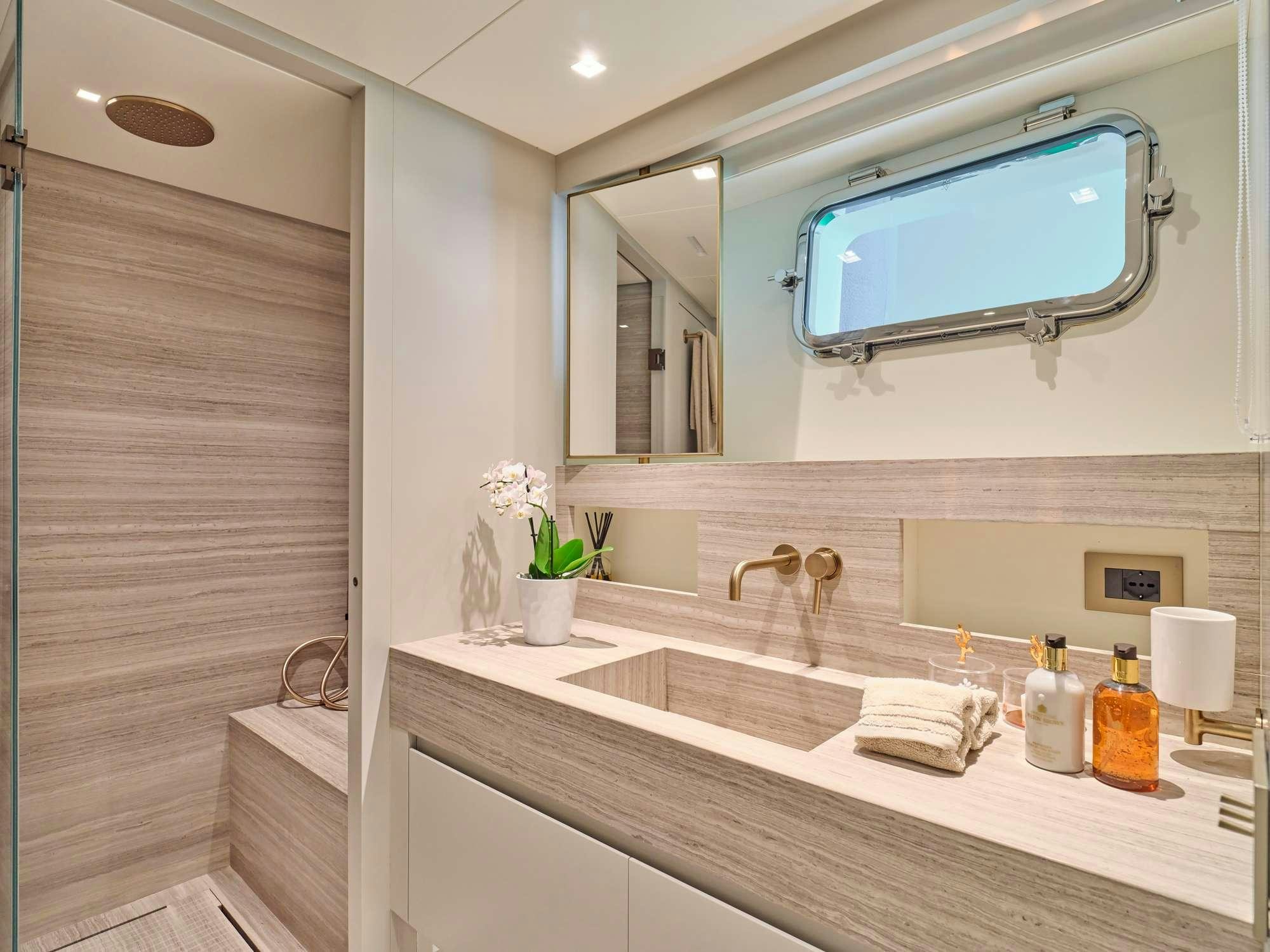 a bathroom with a large mirror aboard MARY Yacht for Charter