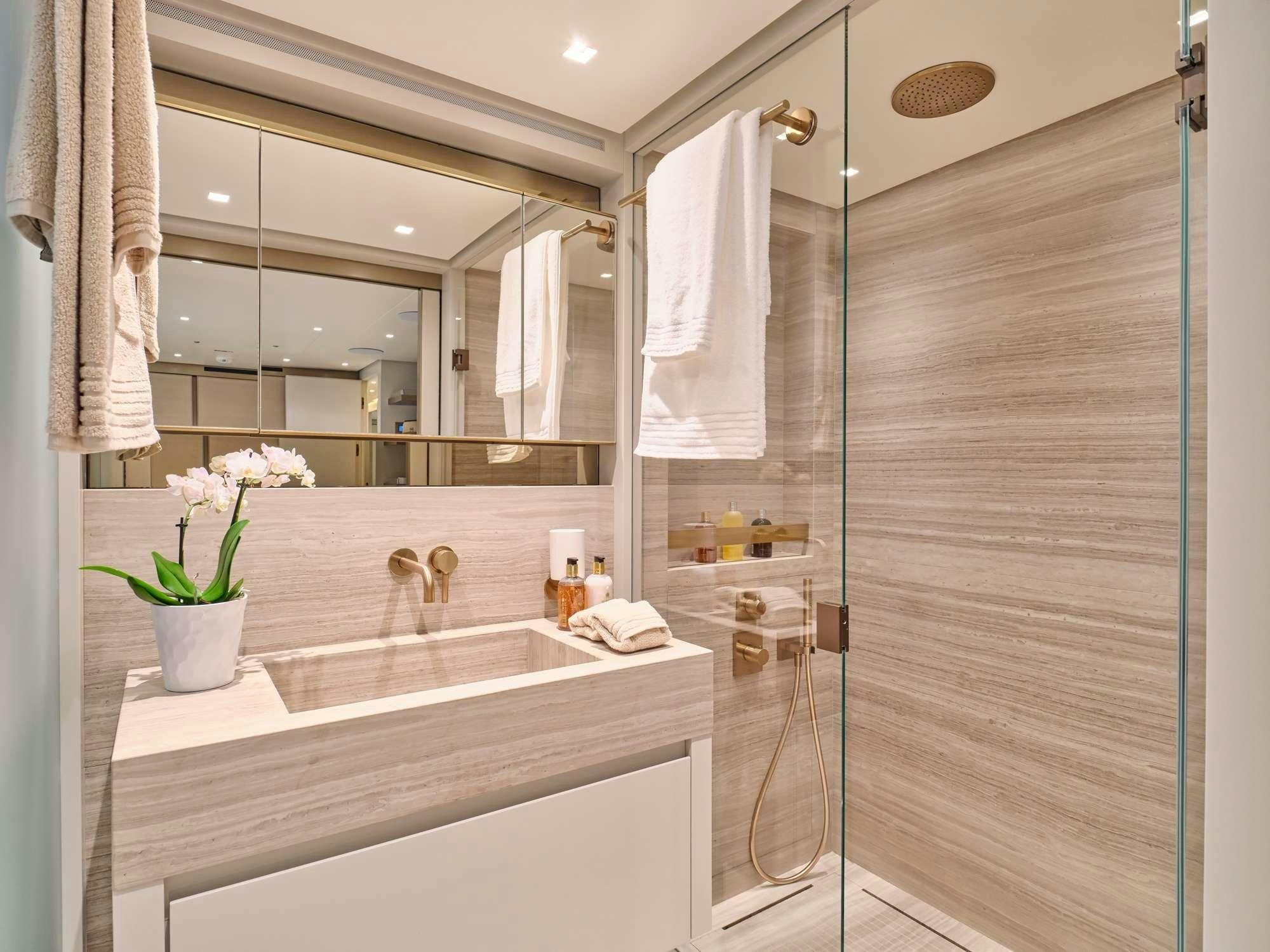 a bathroom with a glass shower aboard MARY Yacht for Charter