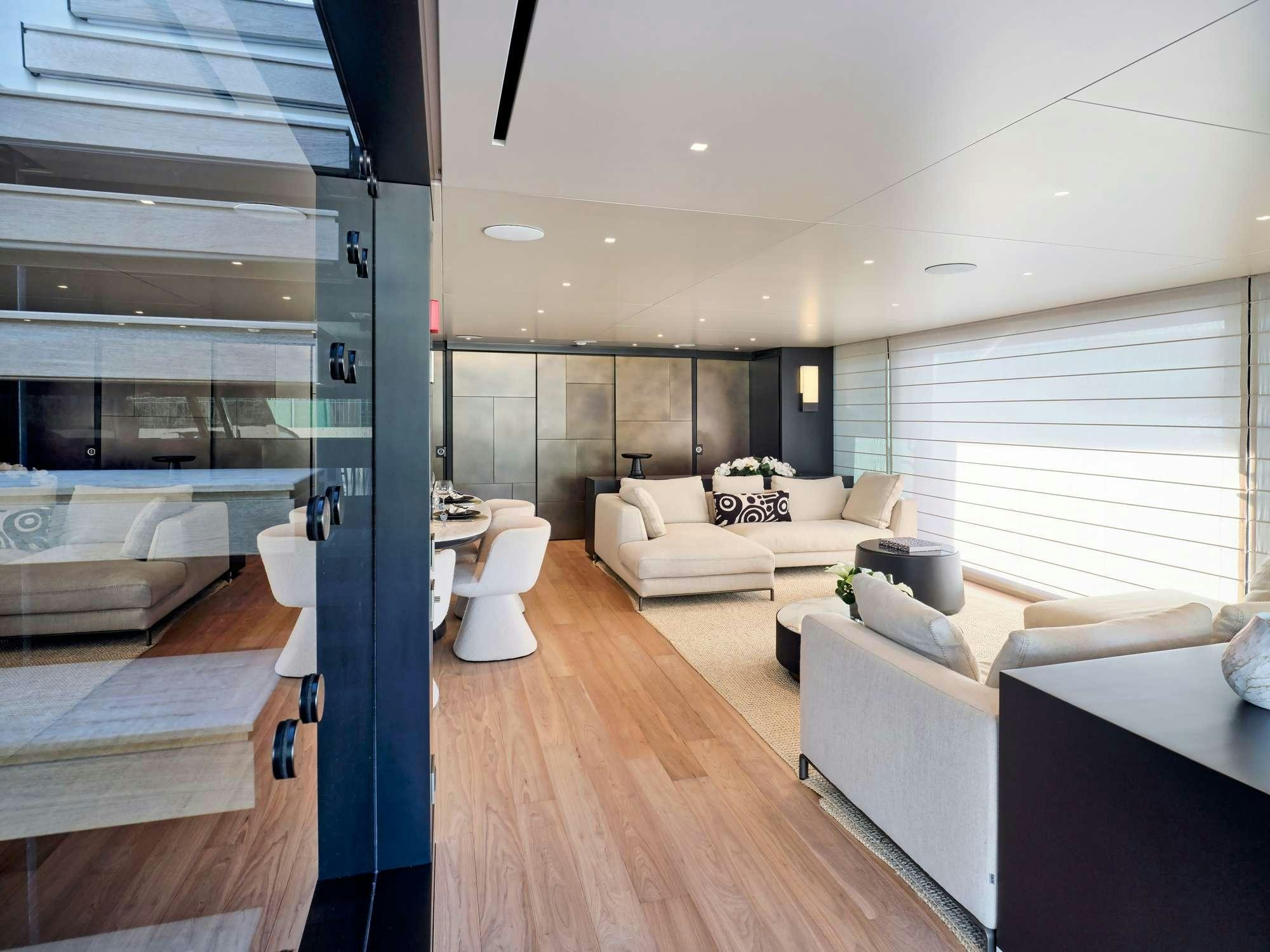 a living room with a wood floor aboard MARY Yacht for Charter