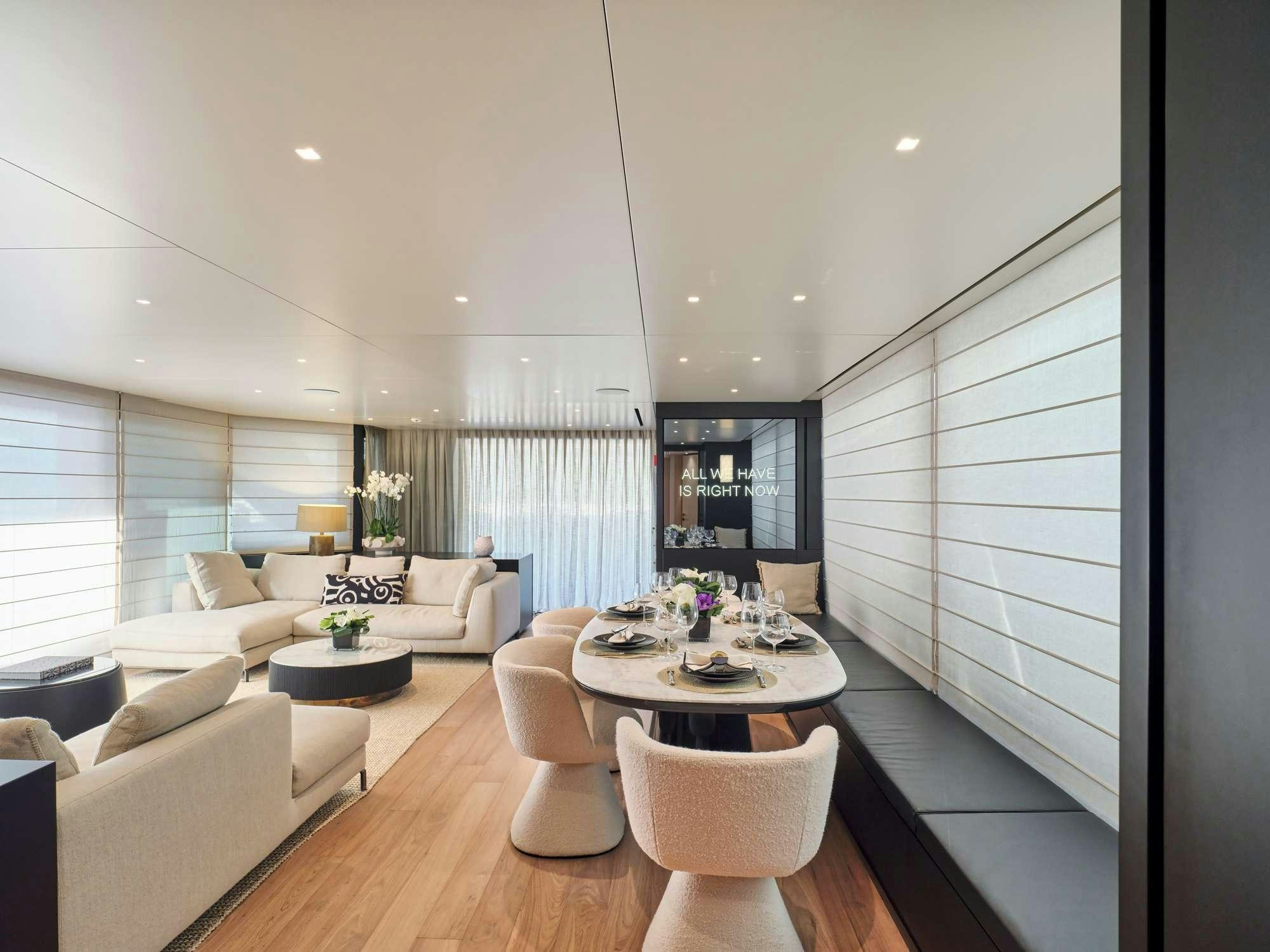a living room with a large window aboard MARY Yacht for Charter