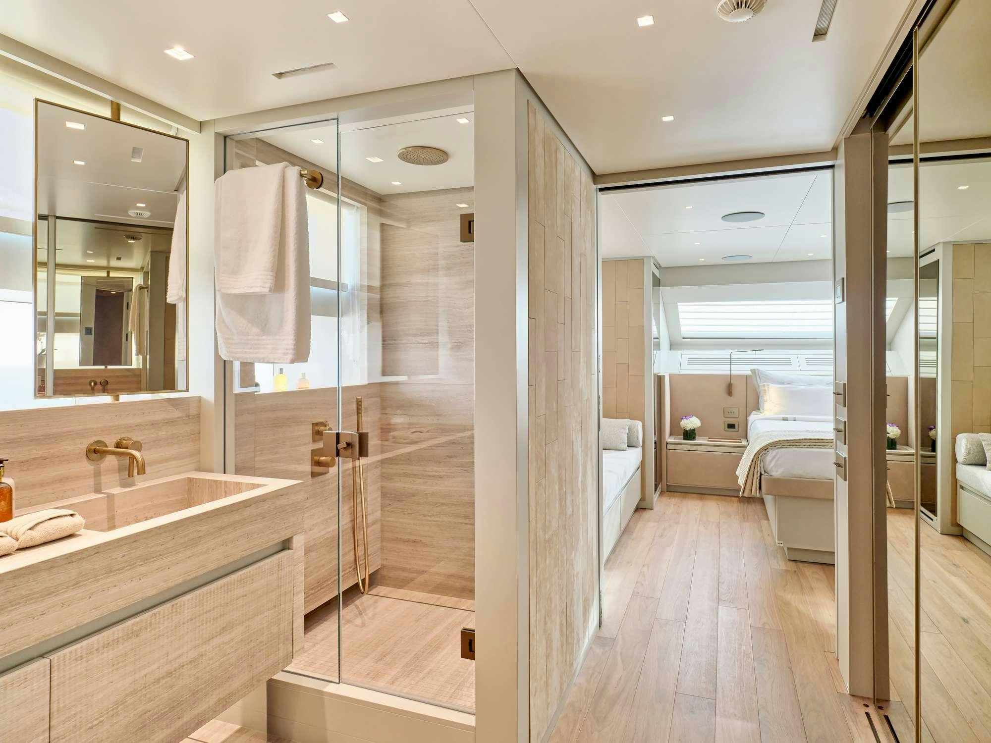 a bathroom with a large glass shower aboard MARY Yacht for Charter