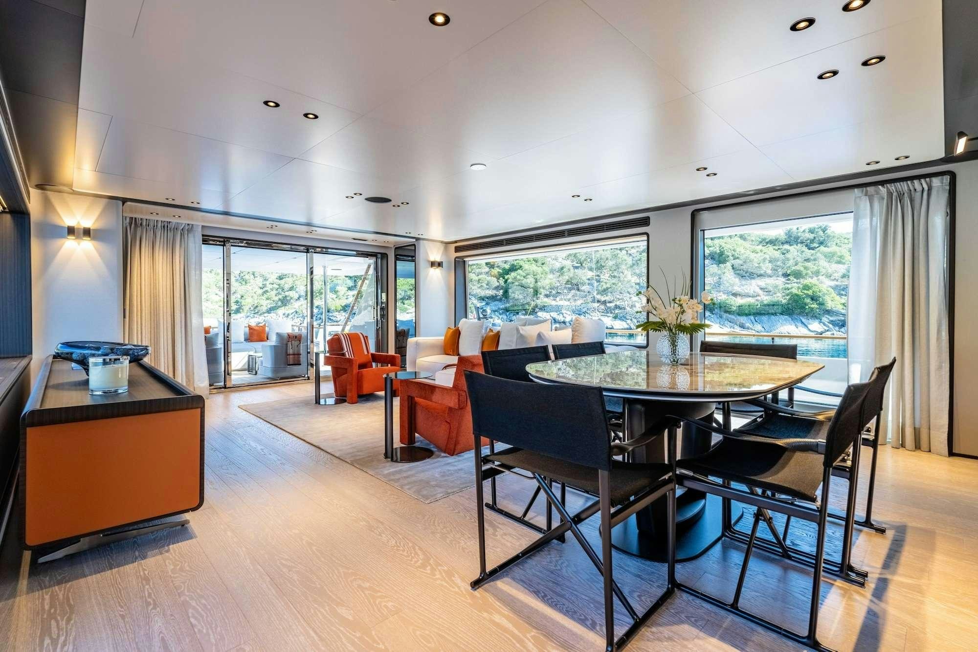 a large dining table in a room aboard AT ONE Yacht for Charter