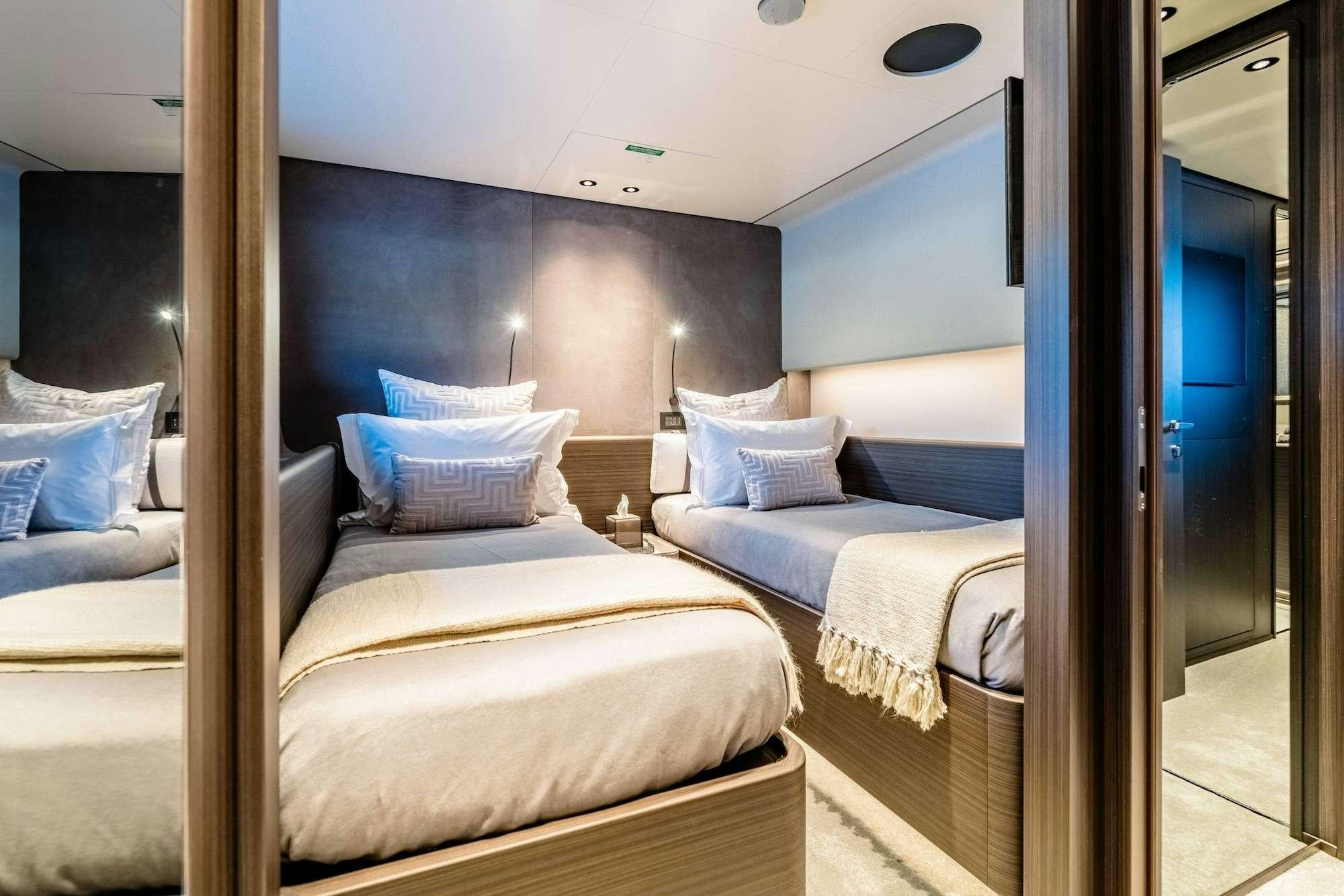 a room with two beds aboard AT ONE Yacht for Charter