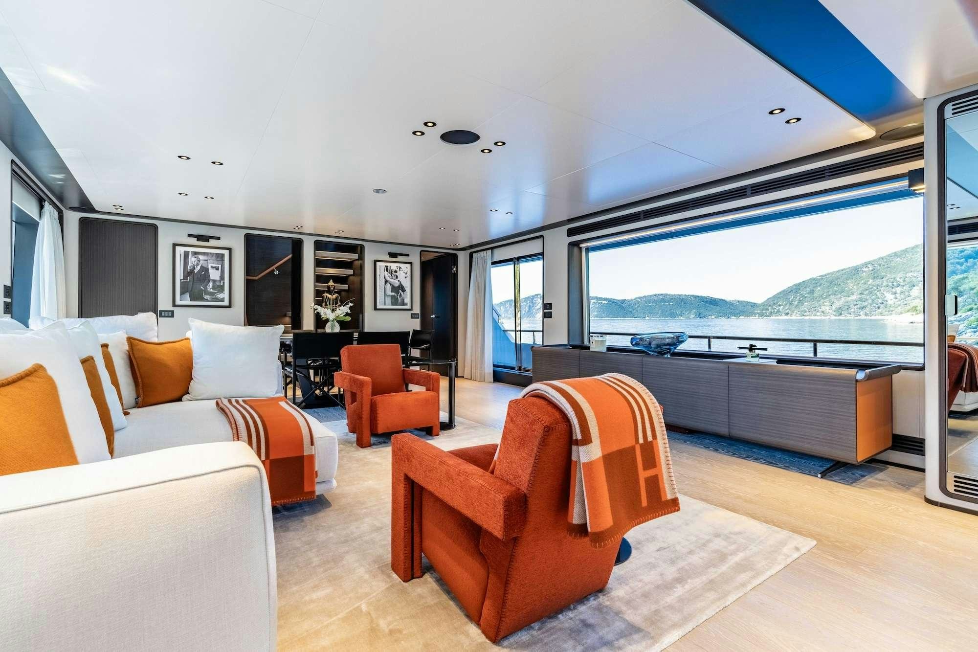 a living room with a large window aboard AT ONE Yacht for Charter