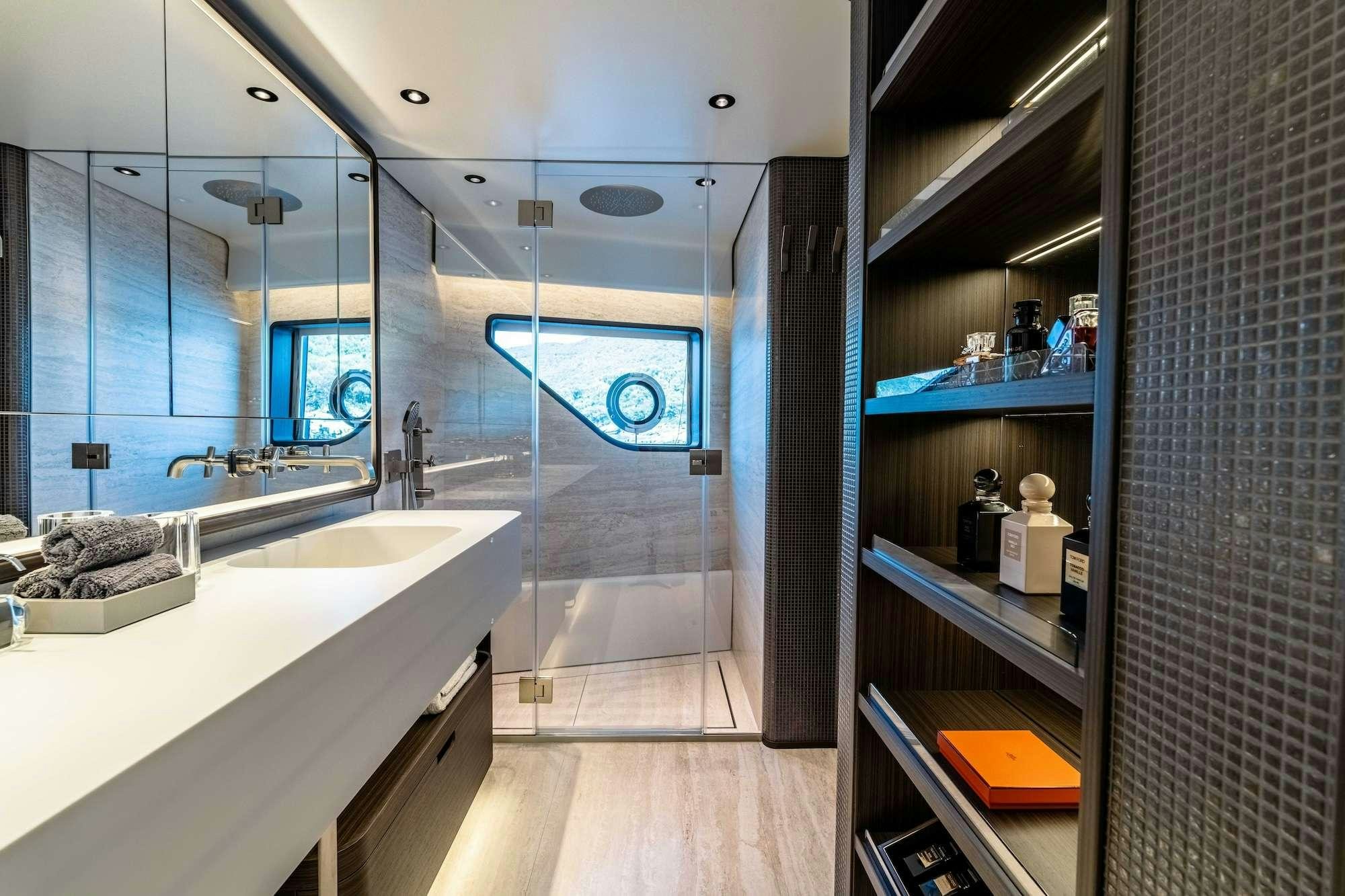 a bathroom with a large mirror aboard AT ONE Yacht for Charter