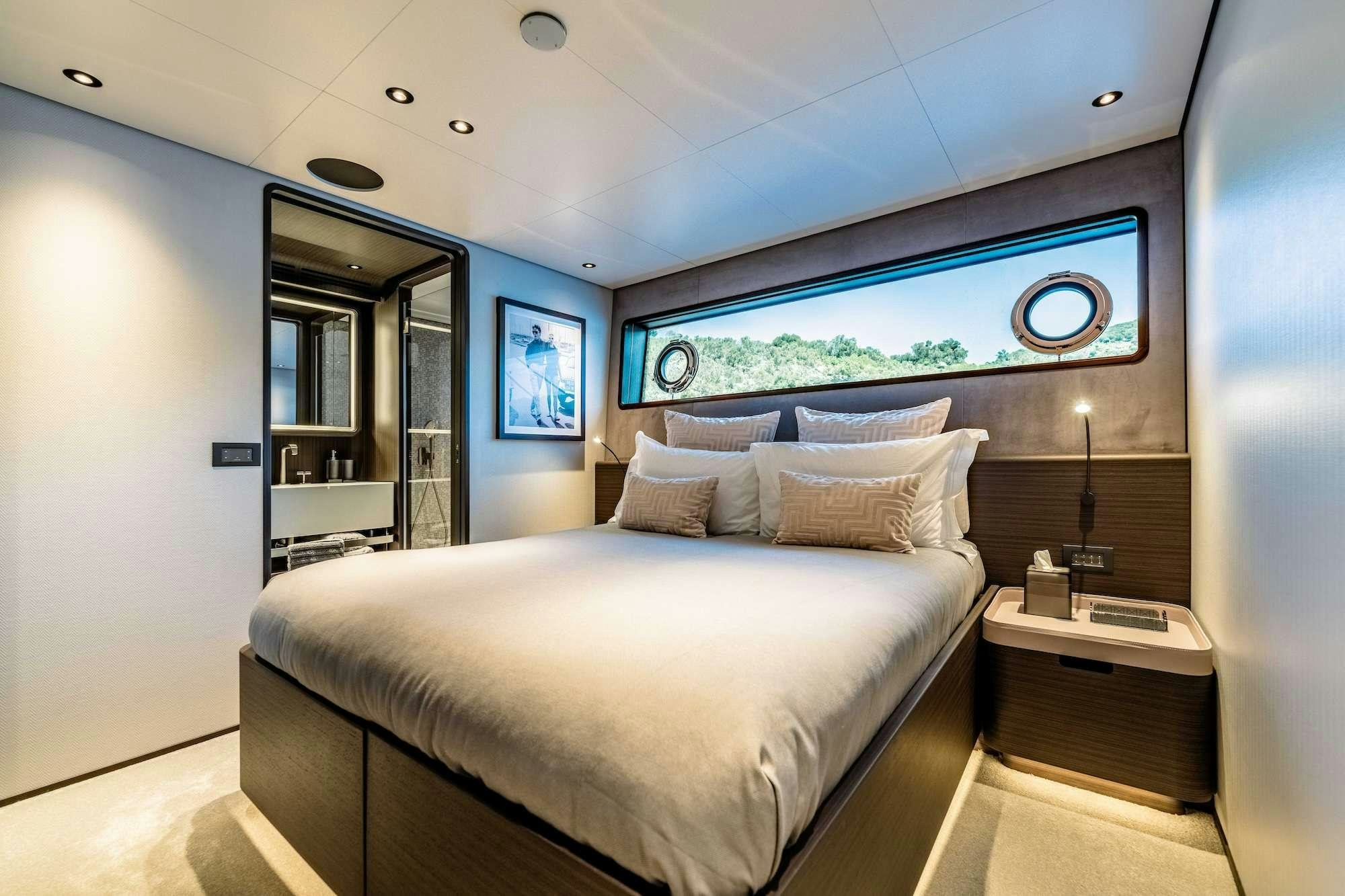a bed in a room aboard AT ONE Yacht for Charter