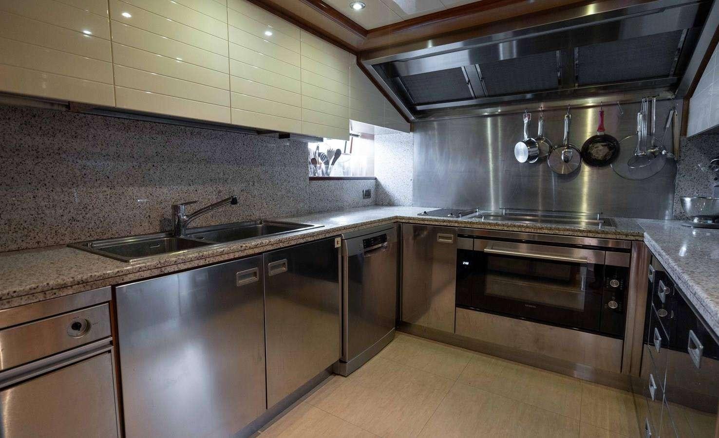 a kitchen with stainless steel appliances aboard PARADISE Yacht for Charter