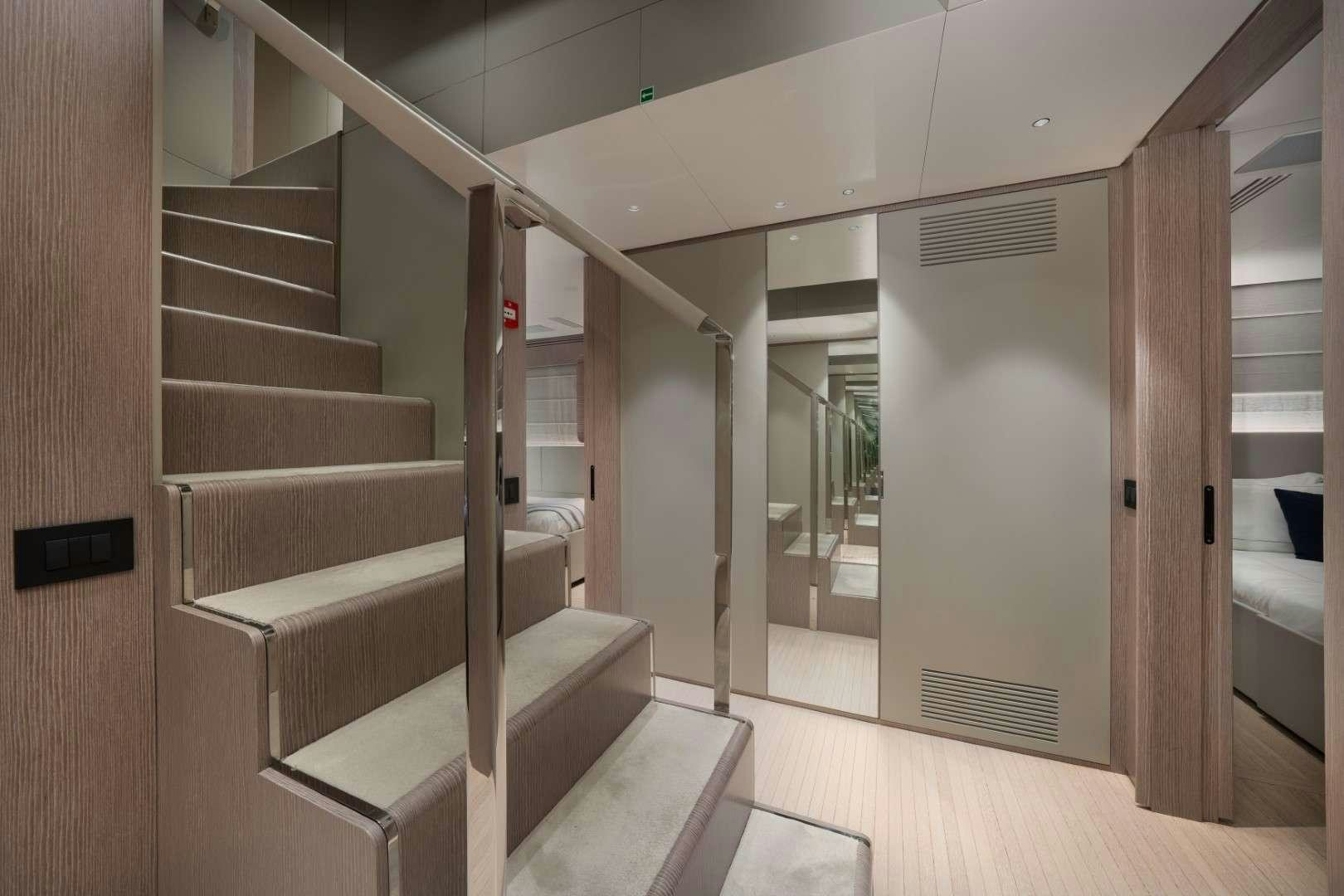 a staircase in a room aboard KINGS LAIR Yacht for Charter