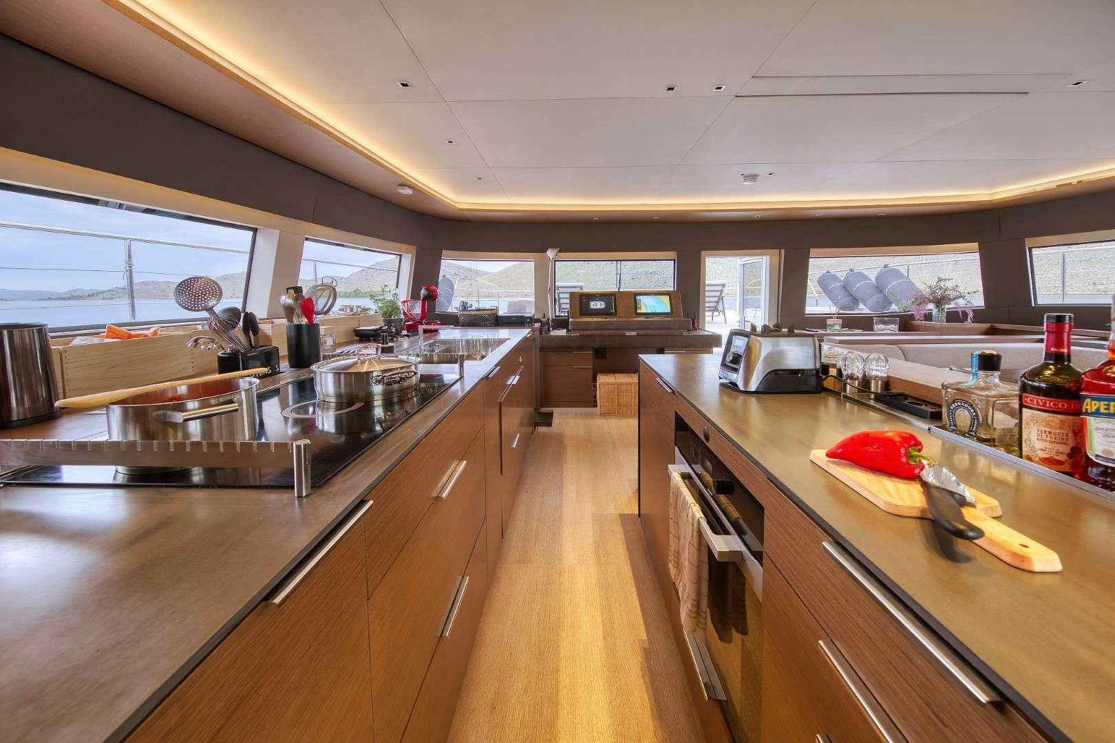 a kitchen with a large island aboard MASTERMIND Yacht for Charter