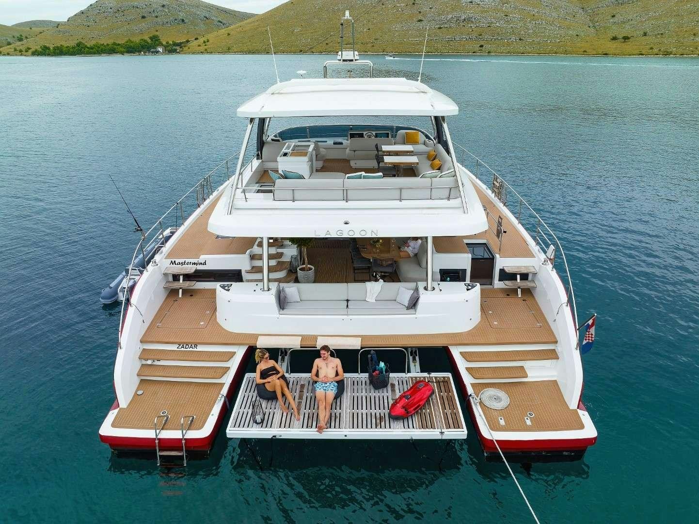 a boat with people on it aboard MASTERMIND Yacht for Charter
