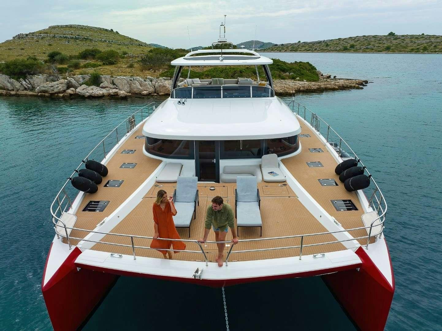 a man and a woman on a boat aboard MASTERMIND Yacht for Charter