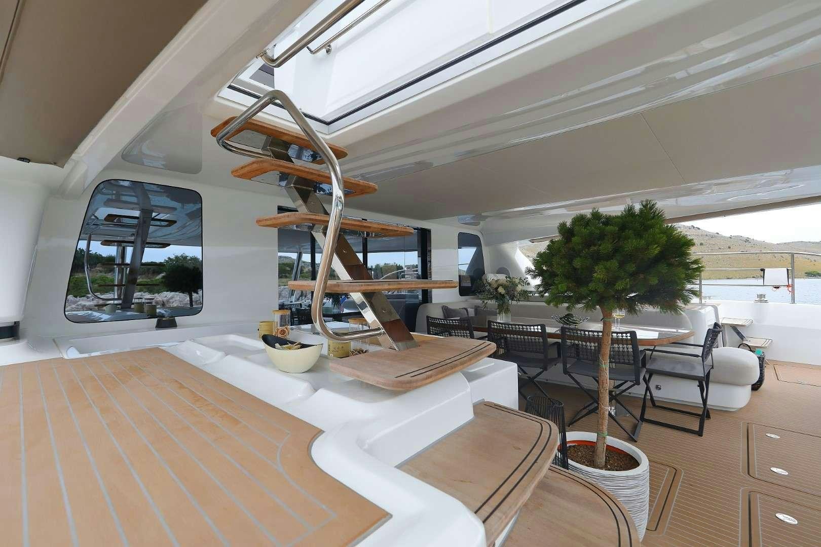 a modern house with a staircase aboard MASTERMIND Yacht for Charter