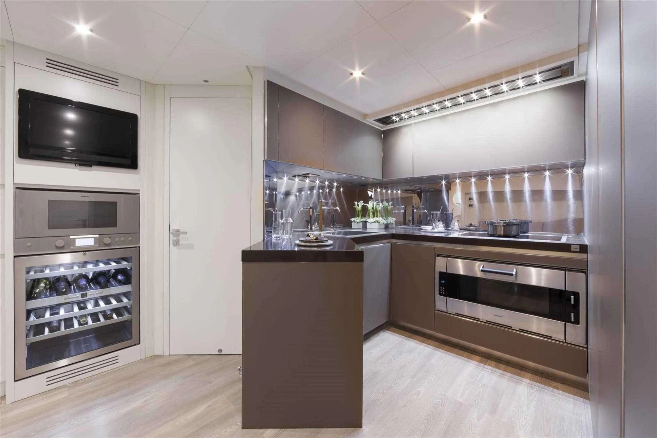 a kitchen with a large oven aboard NAAV Yacht for Charter