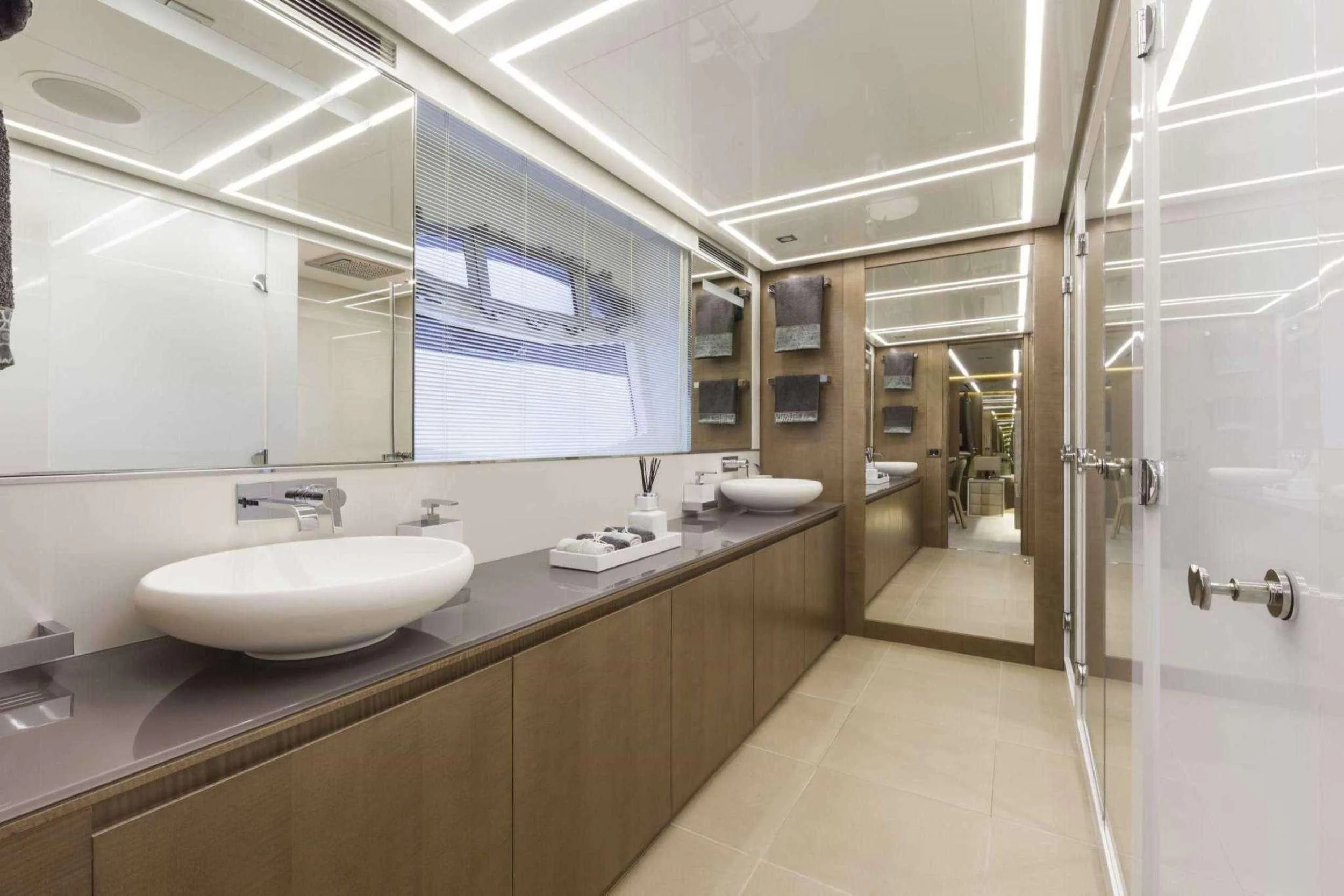 a bathroom with a sink and a mirror aboard NAAV Yacht for Charter