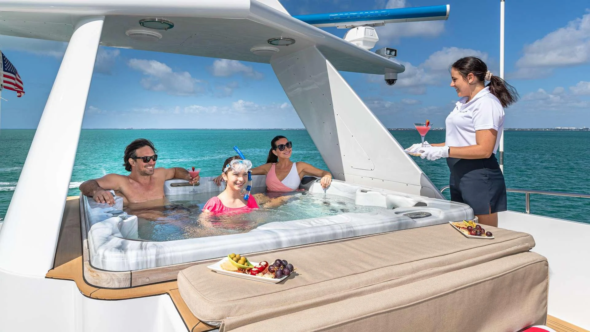 a group of people on a boat aboard SEA DREAMS Yacht for Charter