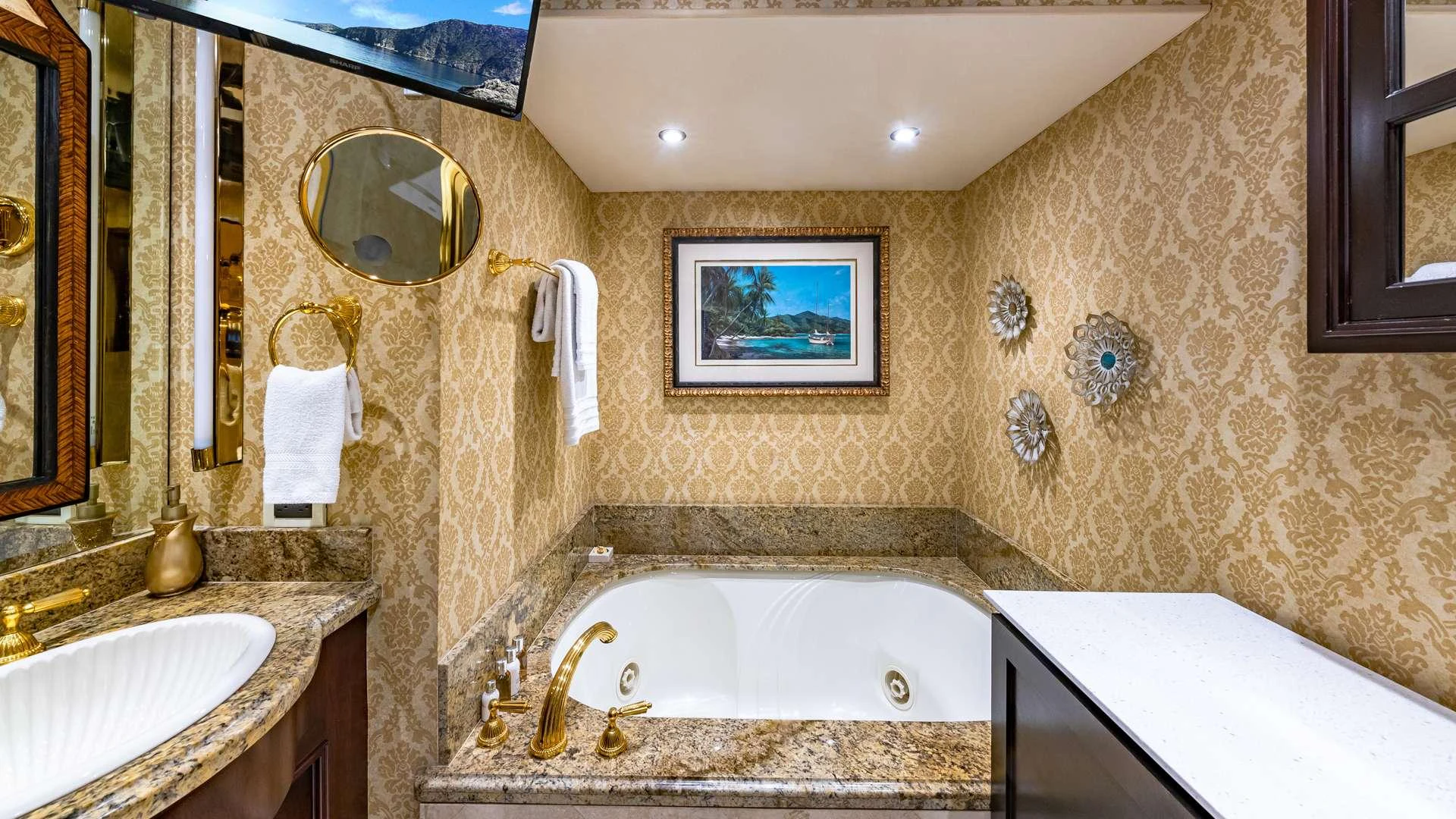 a bathroom with a bathtub and sink aboard SEA DREAMS Yacht for Charter