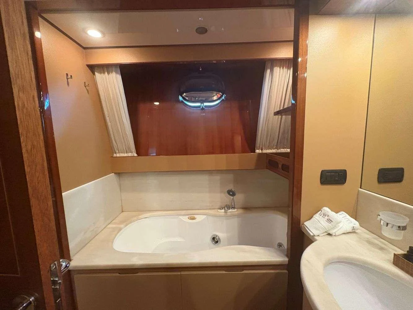a bathroom with a large mirror aboard MAMMA'S Yacht for Charter