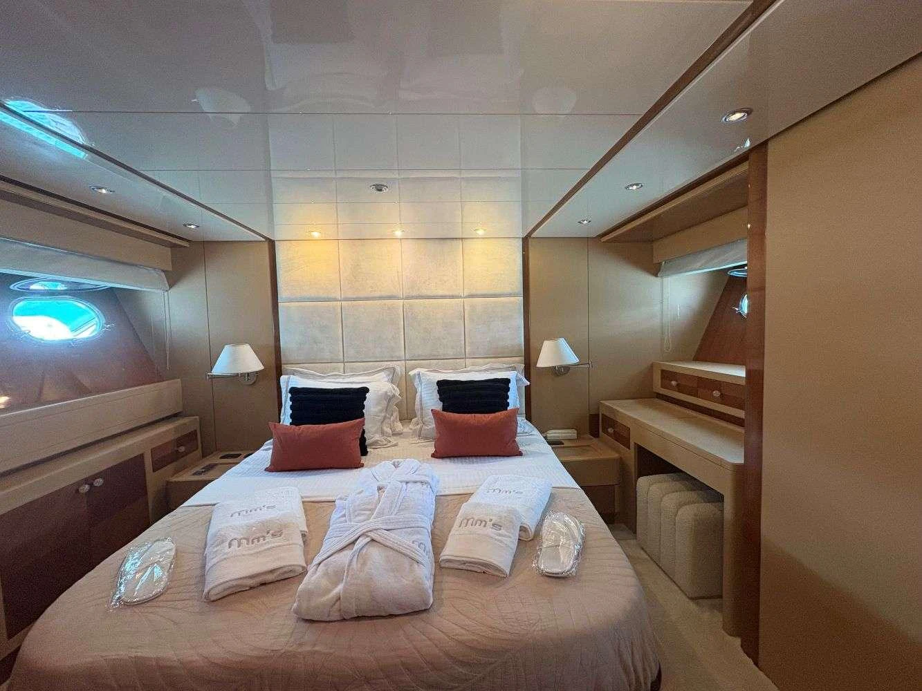 a bed with pillows and pillows aboard MAMMA'S Yacht for Charter