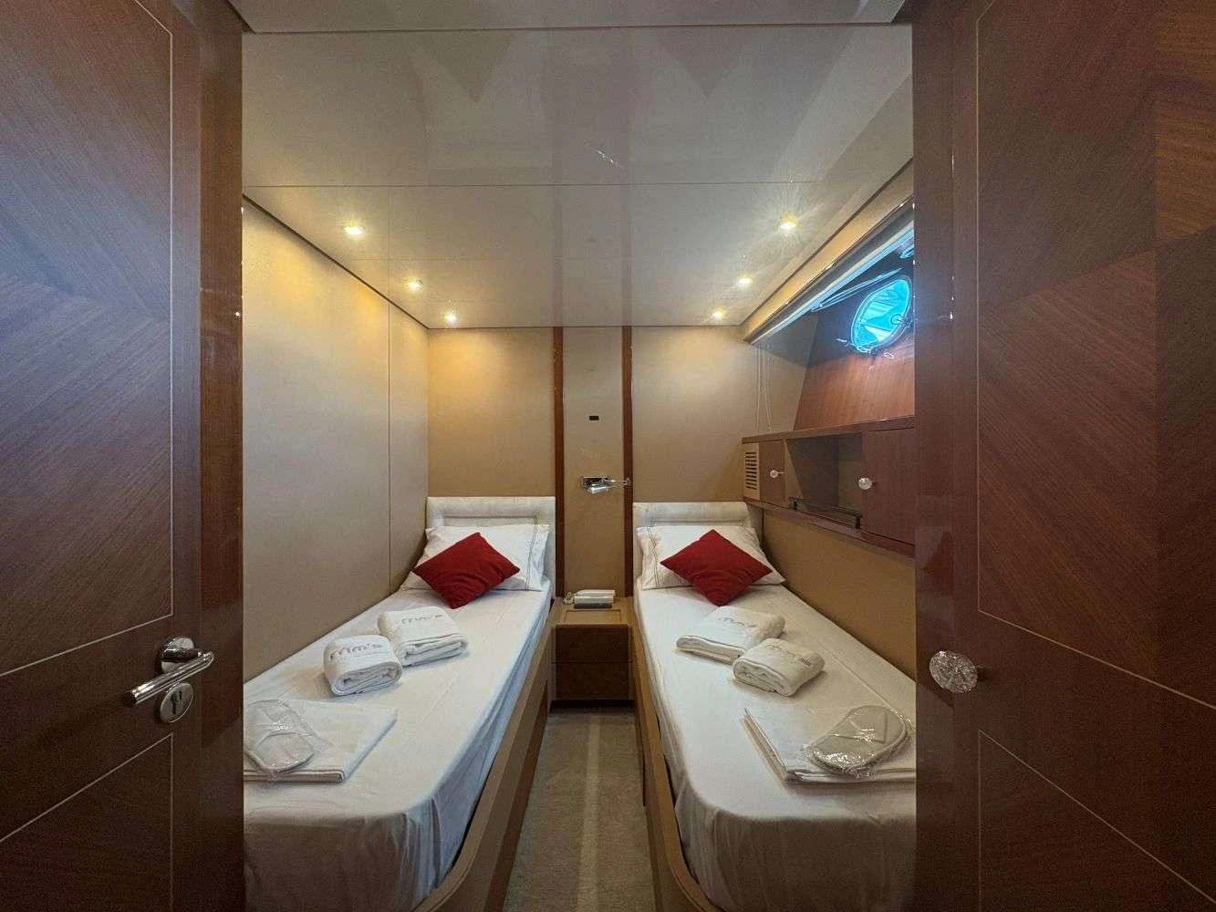 a room with a bed and a mirror aboard MAMMA'S Yacht for Charter